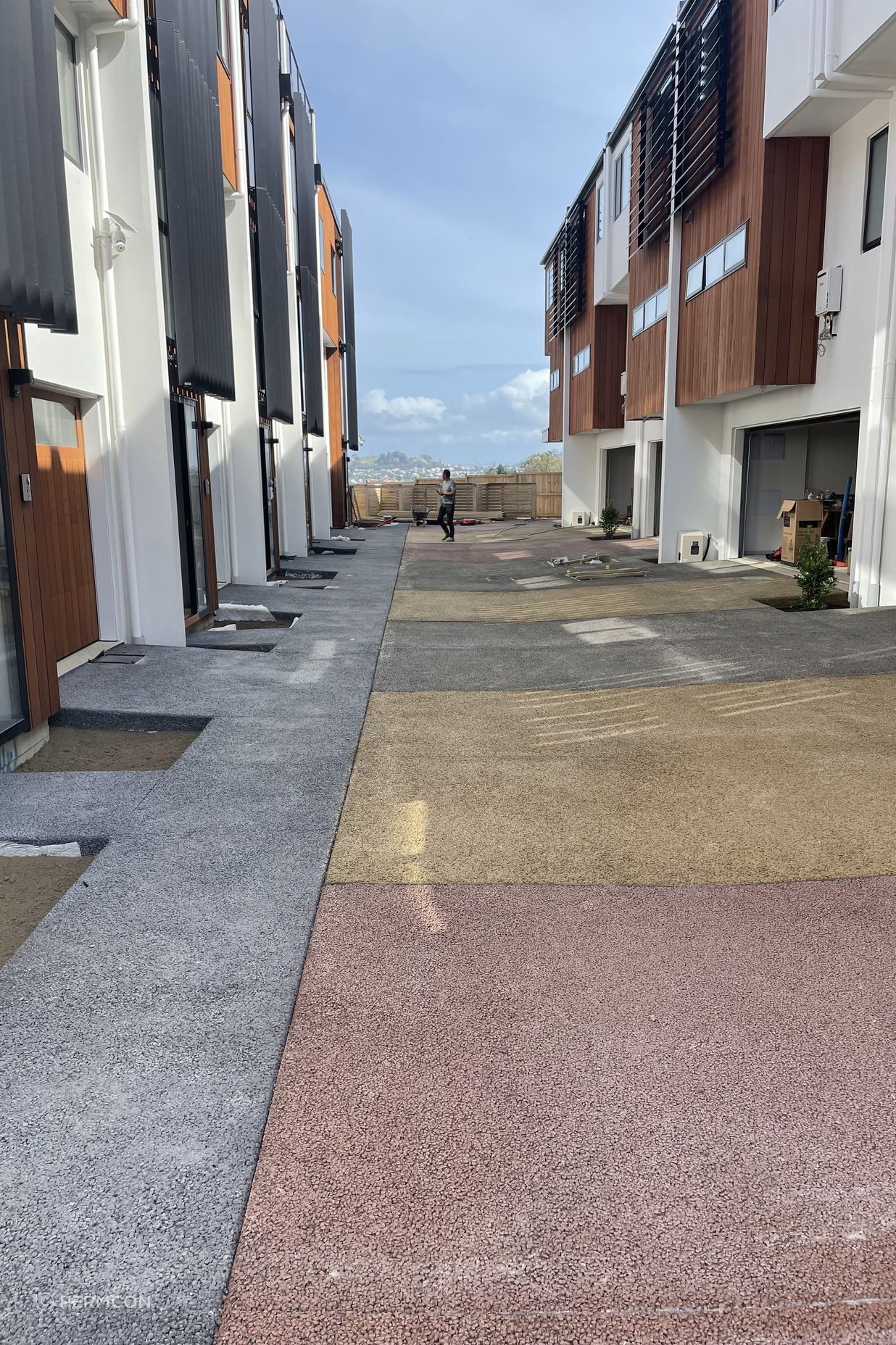 Permeable concrete is made up of stone aggregate, cement, water, and Permcon's special additive. Without a sand filler, the concrete has holes throughout.