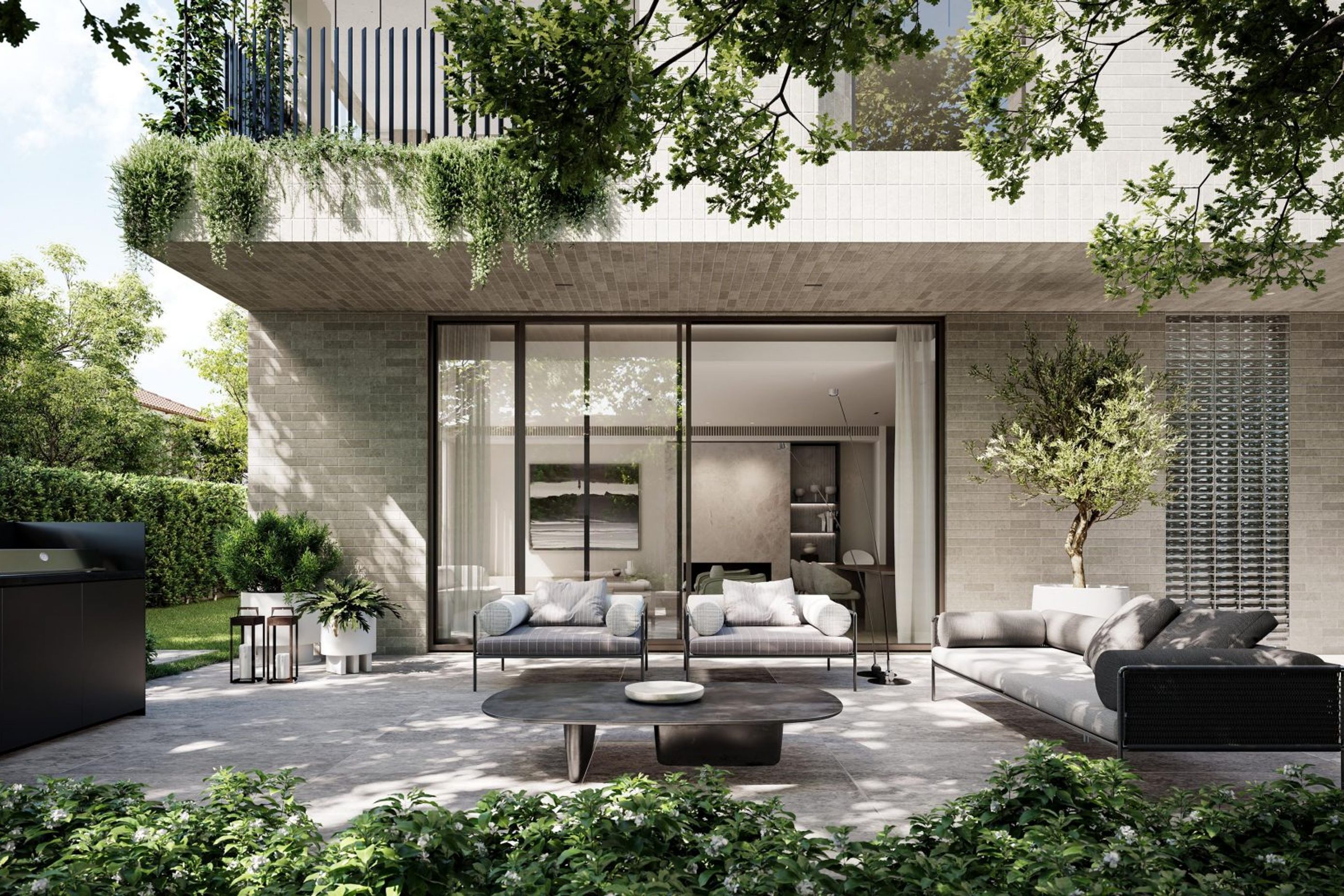 Adorned with lush greenery, the home feels at one with its environment