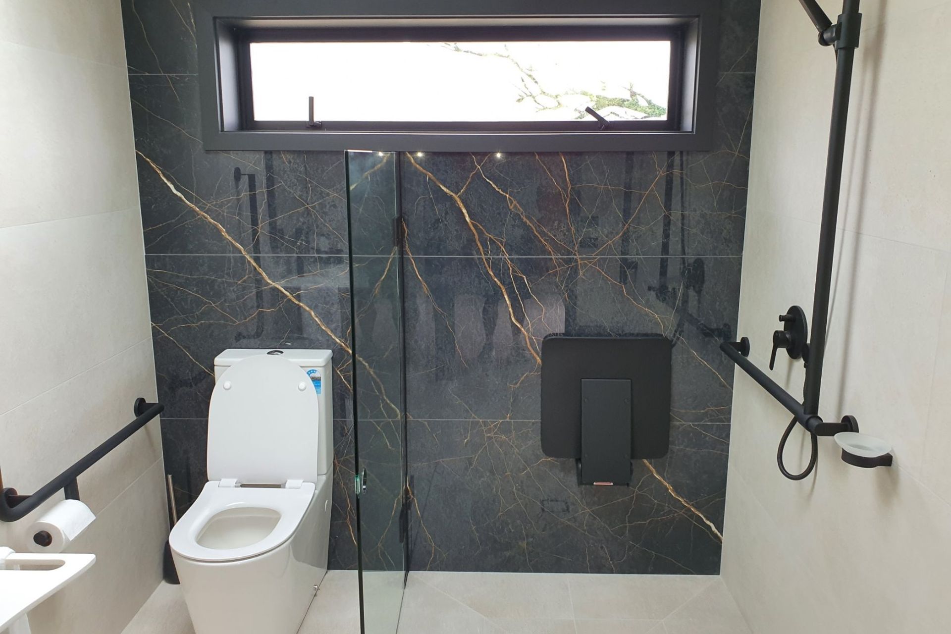 Grab rails should be easily-accessible from a shower seat.
