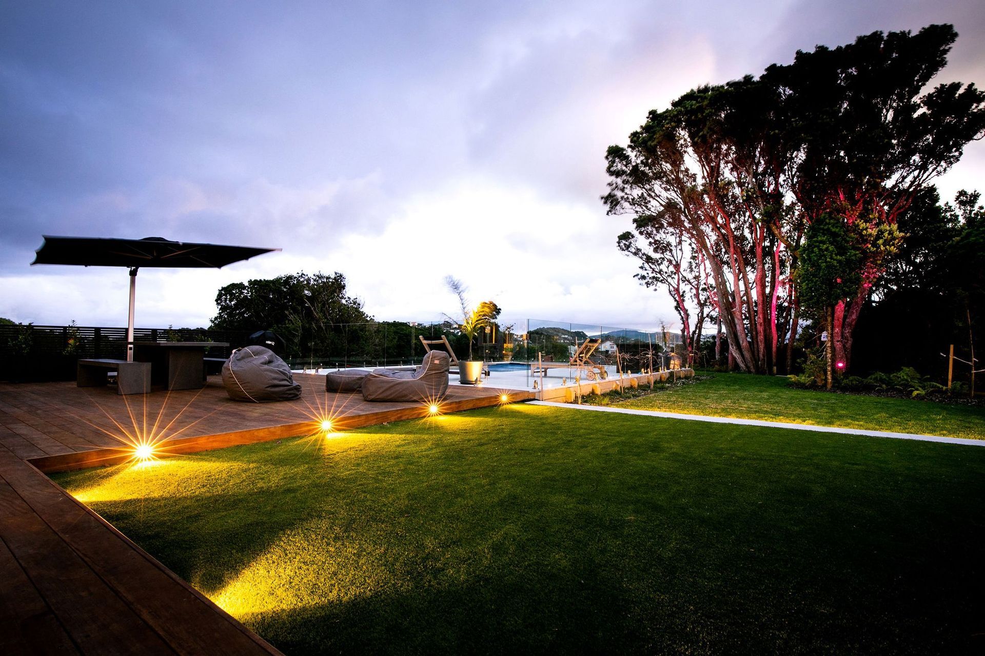 A great use of tree lighting to incorporate these majestic Pohutukawa trees in Khandallah, Wellington.