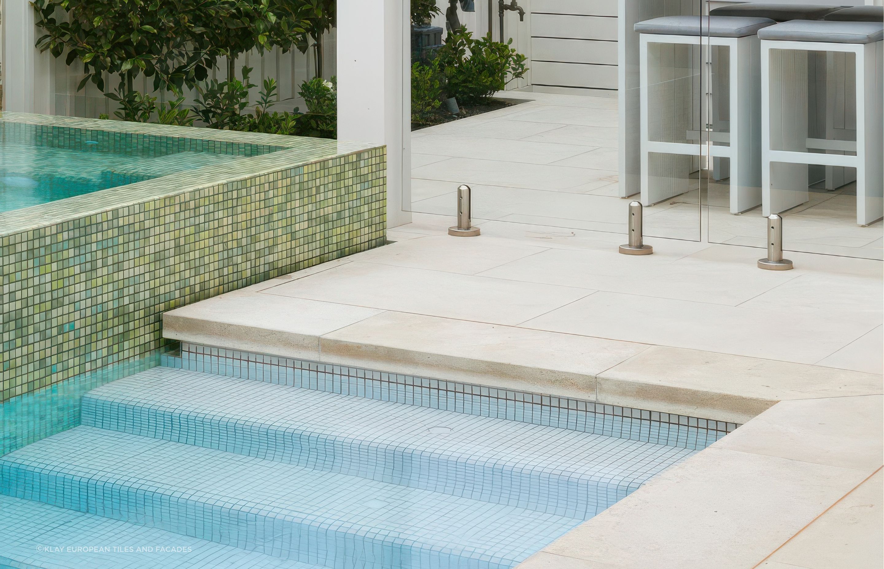 Limestone with Fresh Snow White 25×25 Pool Tile. Pool designed by Mint Landscape Design
