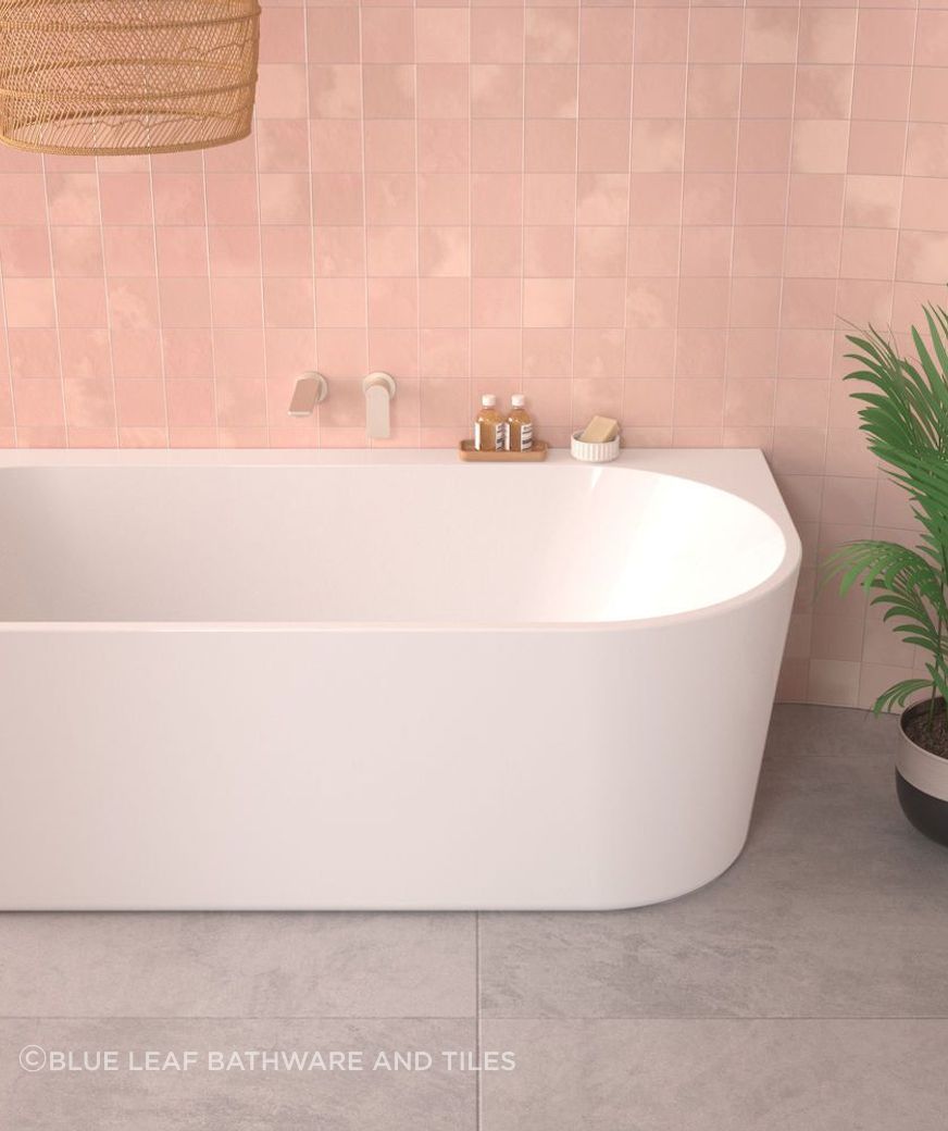 This beautiful oval back to wall bath from Blue Leaf is perfect for bathrooms with limited space. The seamless design features minimalist styling and is available in three sizes.