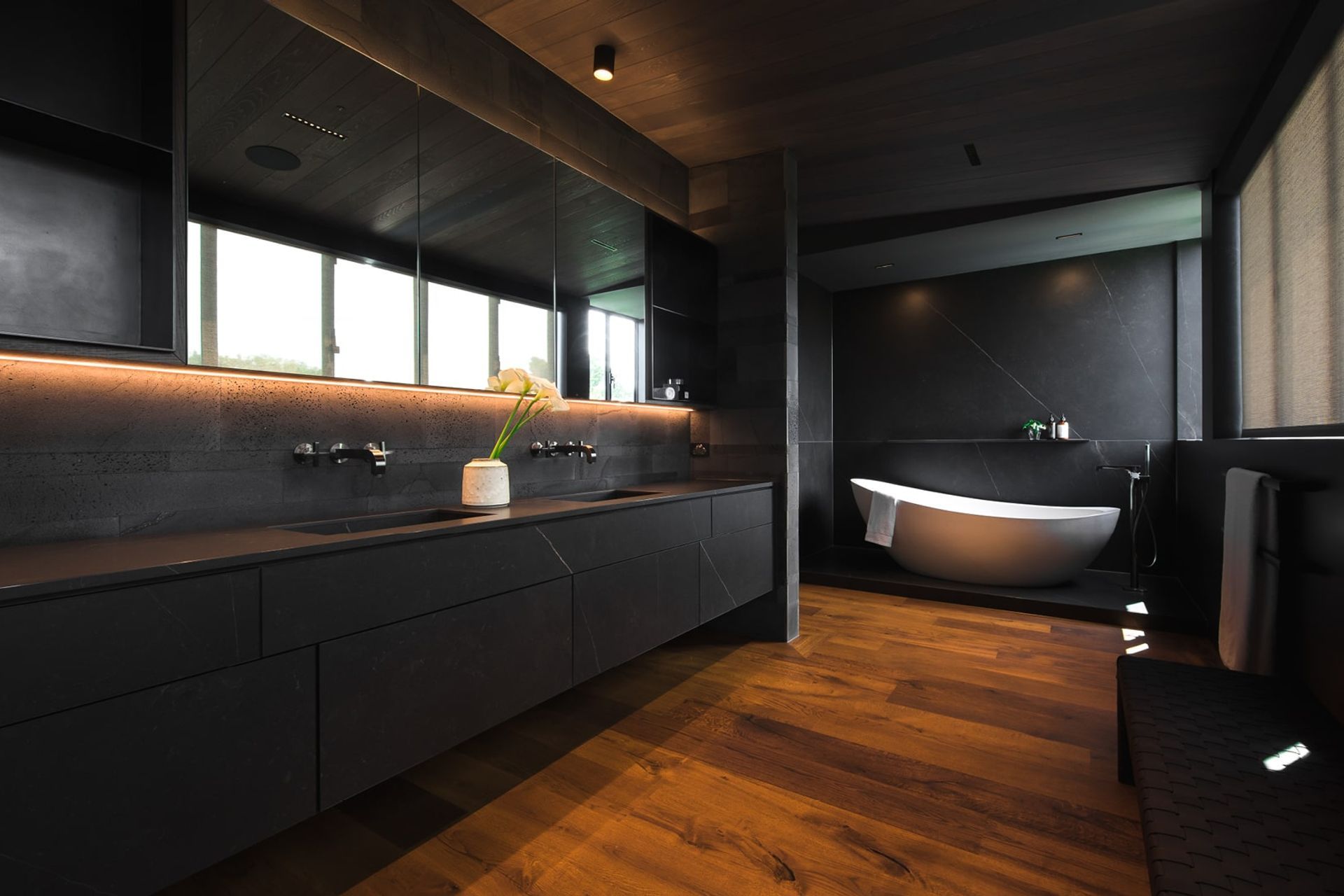 Controlled lighting allows you to set the mood with style with no shortage of it in this sublime bathroom in a Parnell home