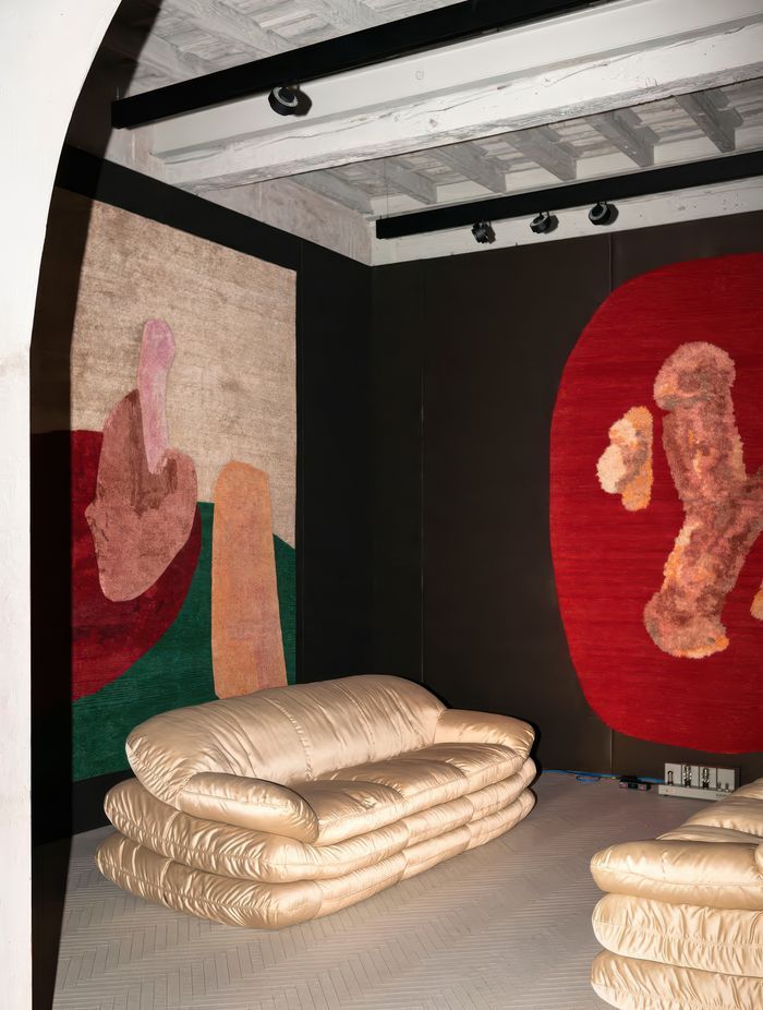 Spare Parts and Poking Fun Rugs with furniture by Tacchini