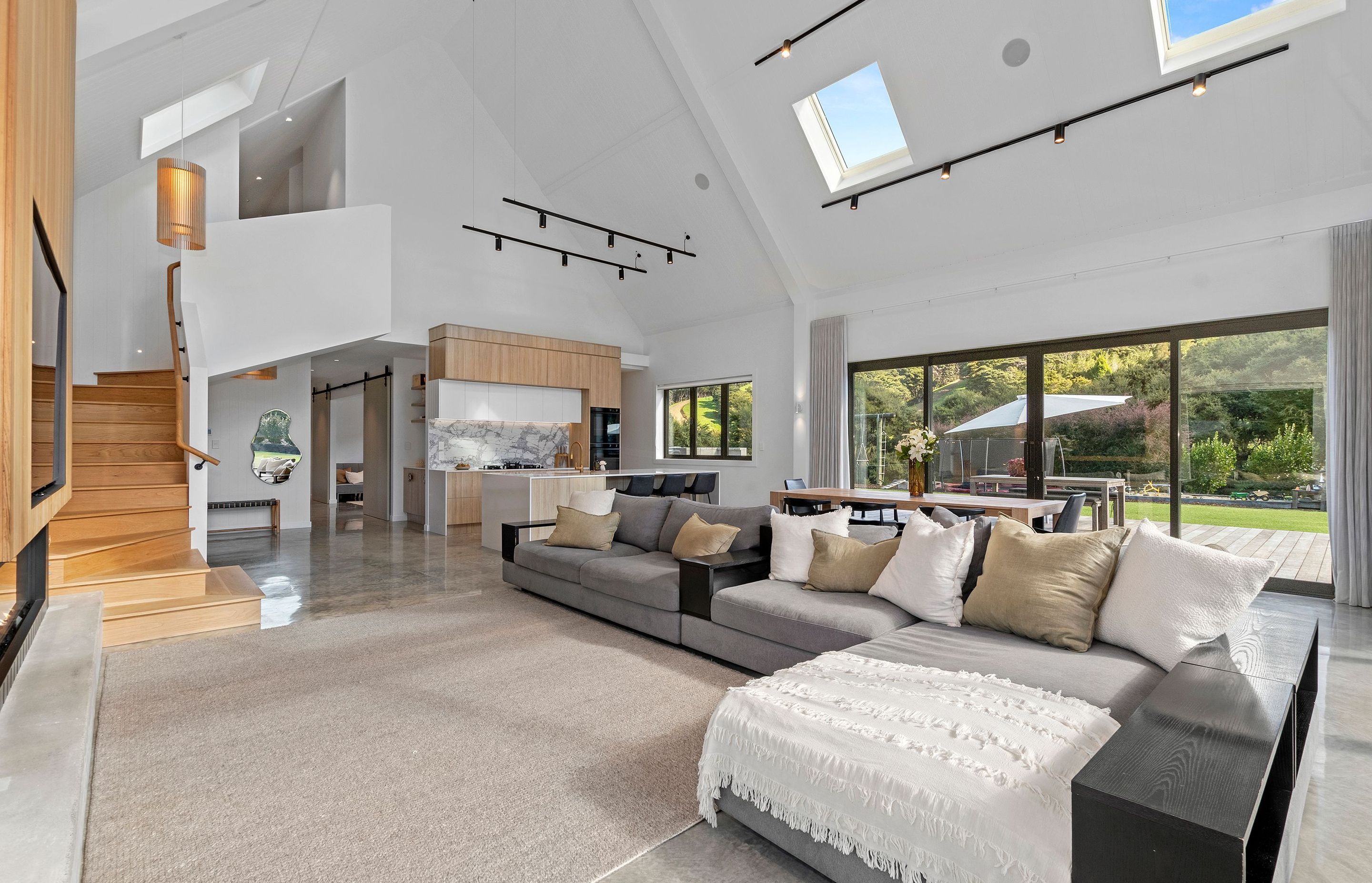 The timber stairs lead from the living area into the more private 'family zone' upstairs.