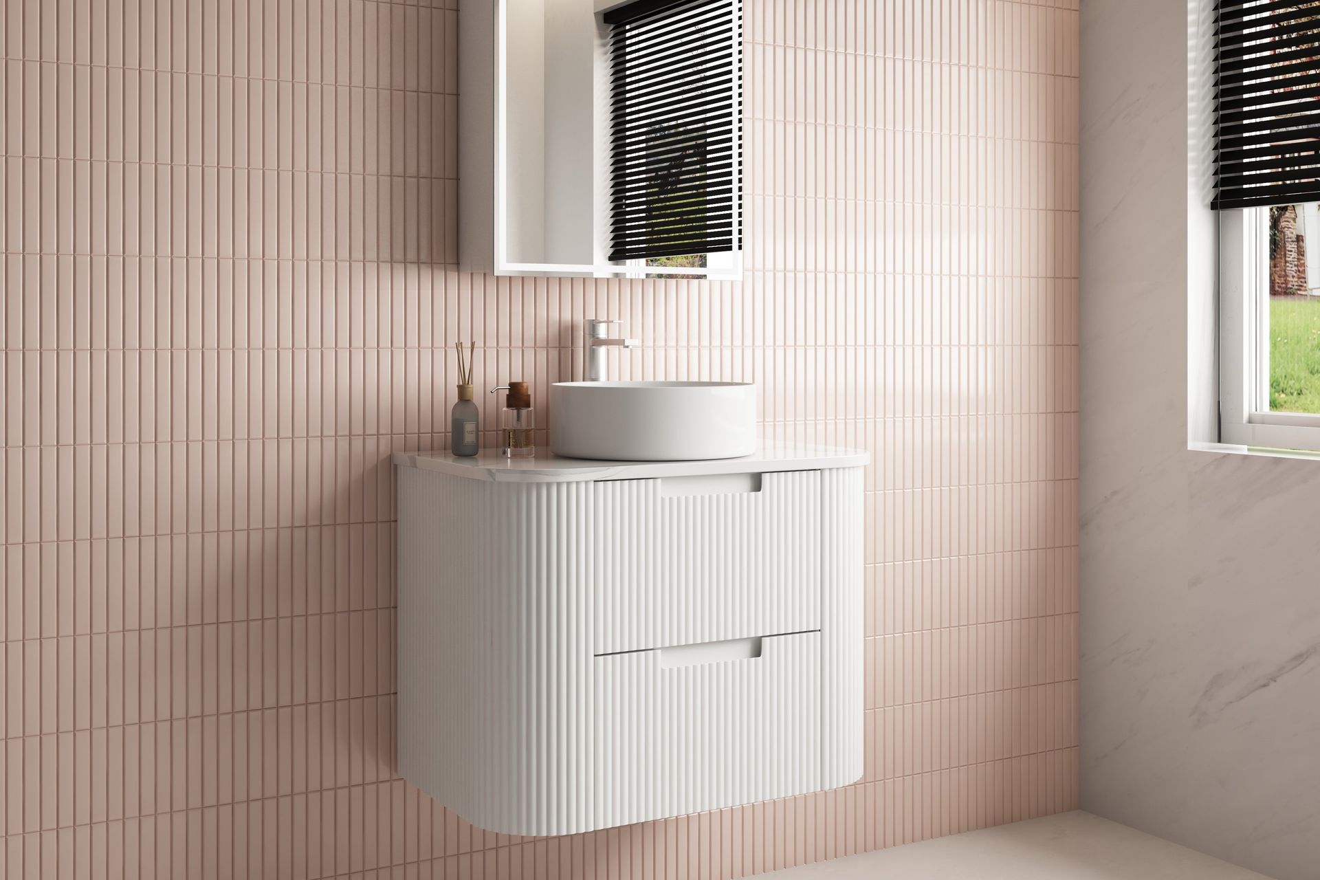 The Aulic Curva Wall Hung Vanity features a space-saving, wall-hung structure with curved ends and stacked drawers — the perfect choice for the modern home.
