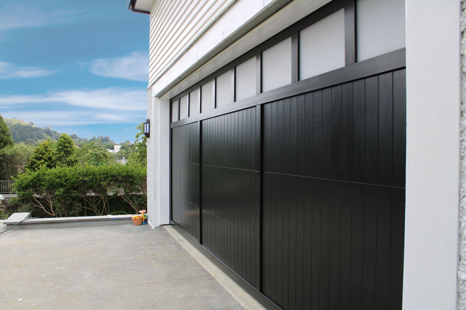 “Garages that are used as home gyms or offices benefit from windows; consider a full plexiglass door or adding windows to another garage door style.”