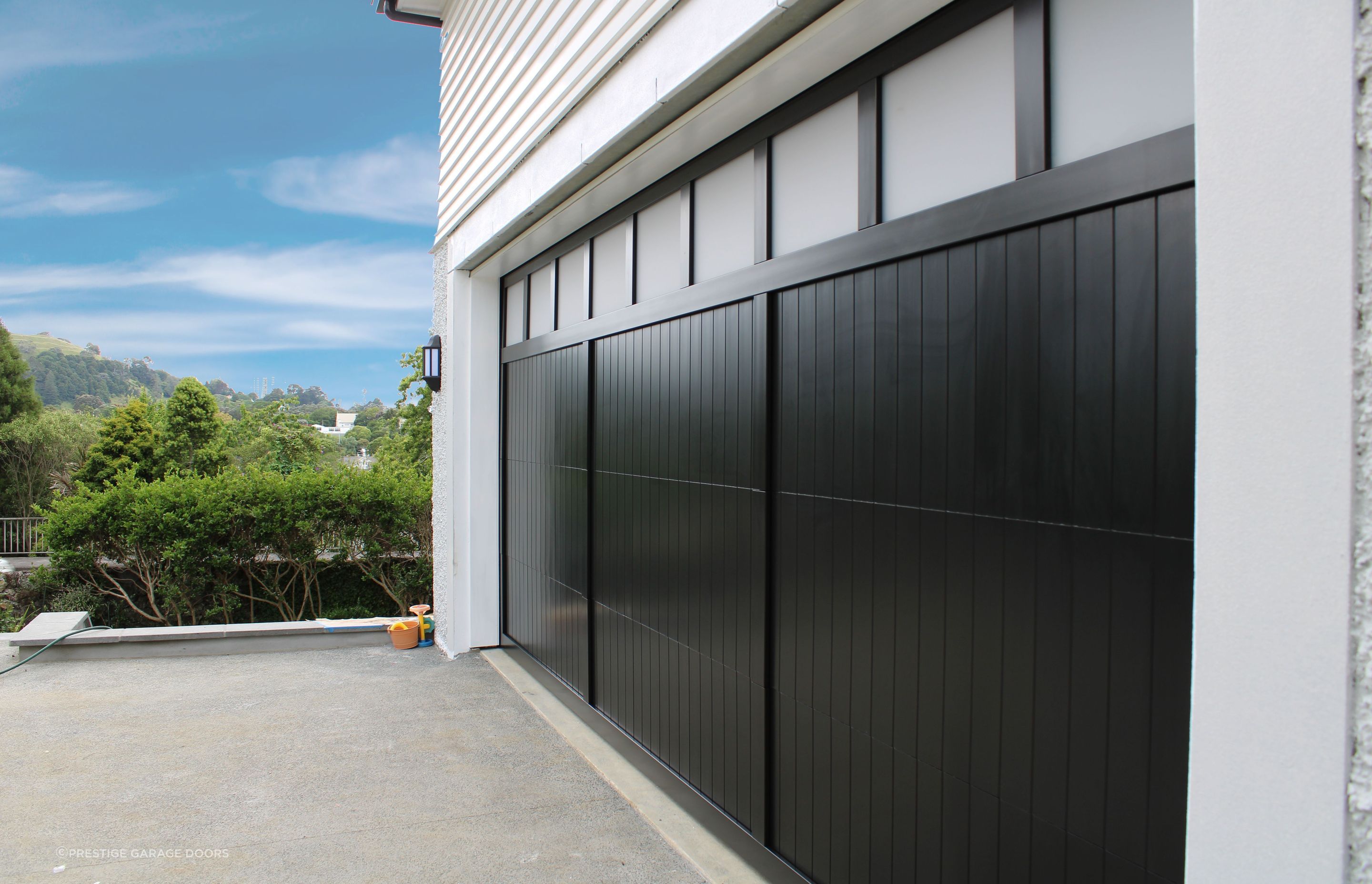 “Garages that are used as home gyms or offices benefit from windows; consider a full plexiglass door or adding windows to another garage door style.”