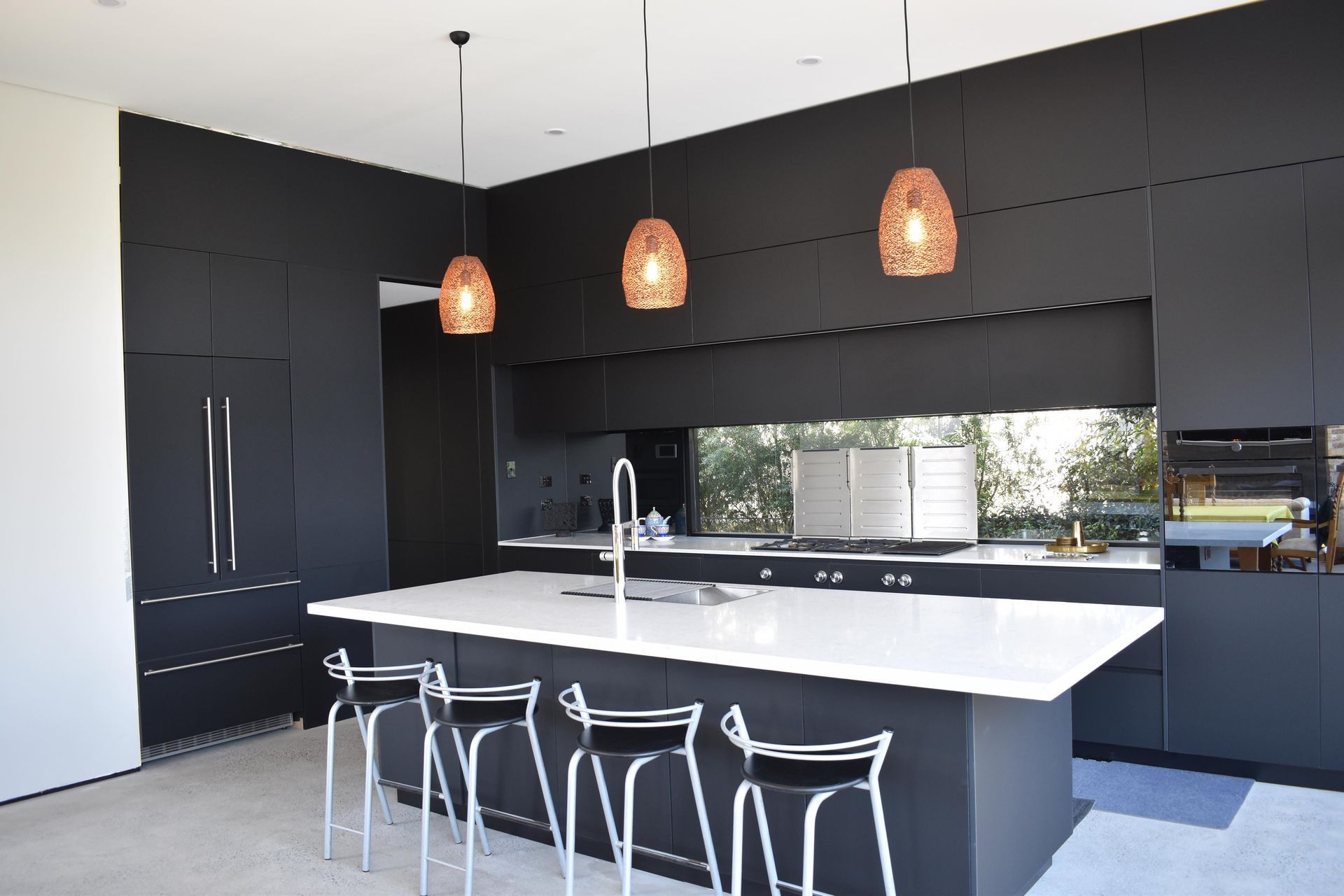 Anti-fingerprint black kitchen by JPC Kitchens