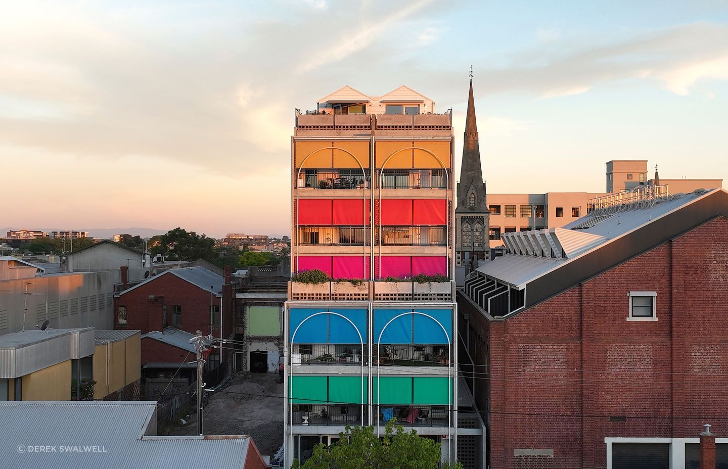 The playful colours selected for the sun shading on this multi-residential project give it personality and character.