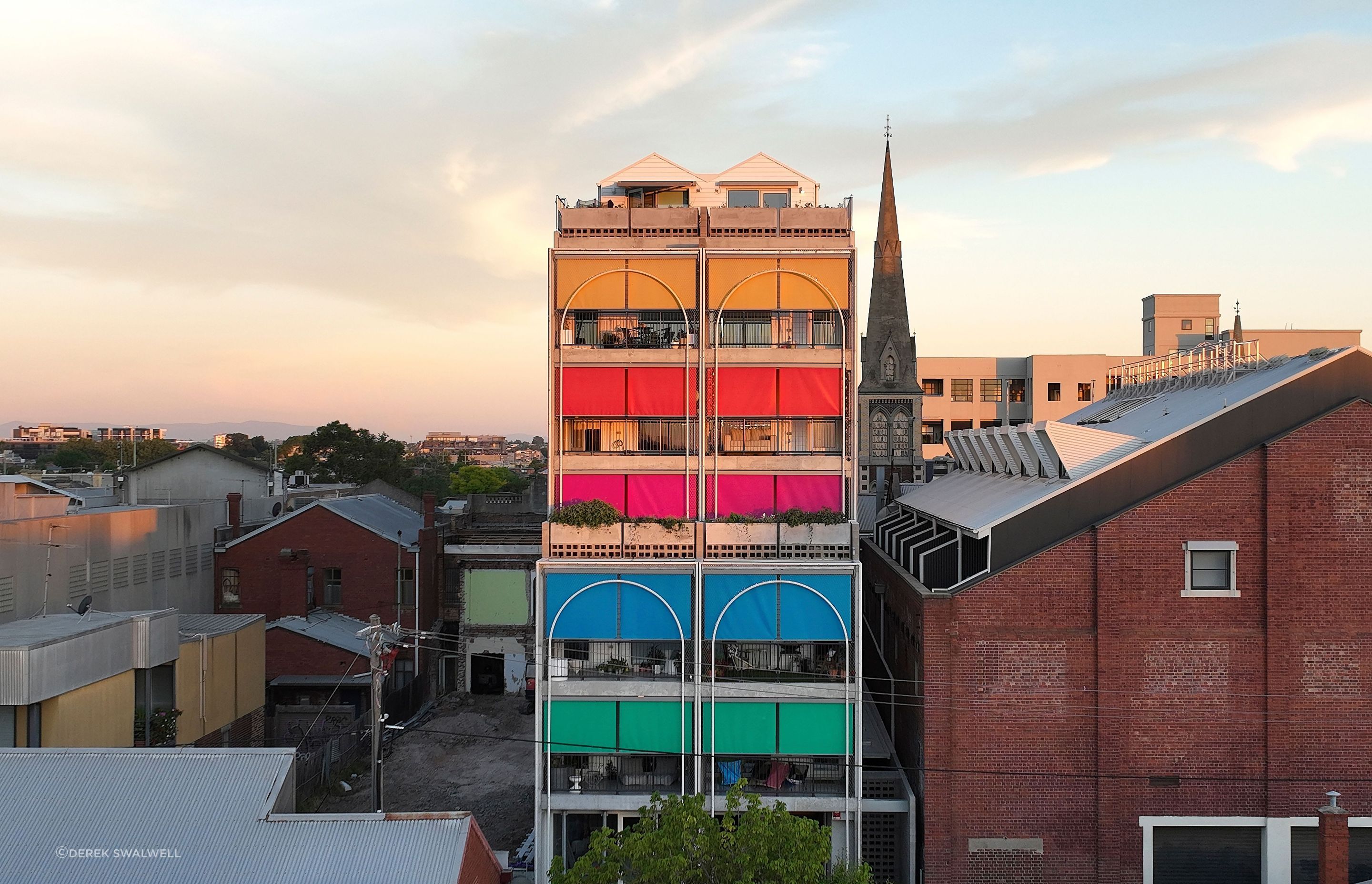 The playful colours selected for the sun shading on this multi-residential project give it personality and character.