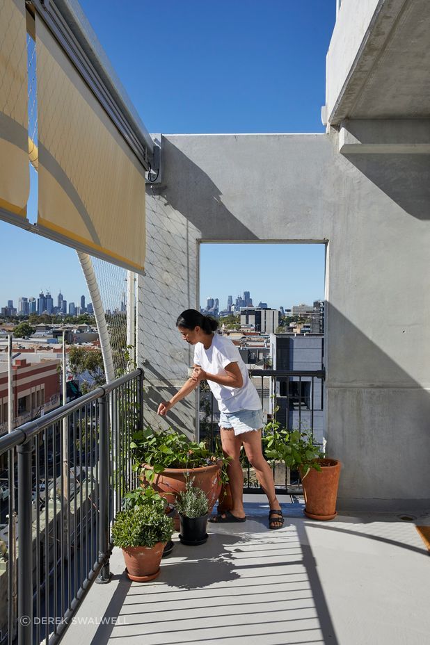A resident is able to control shading from her terrace.