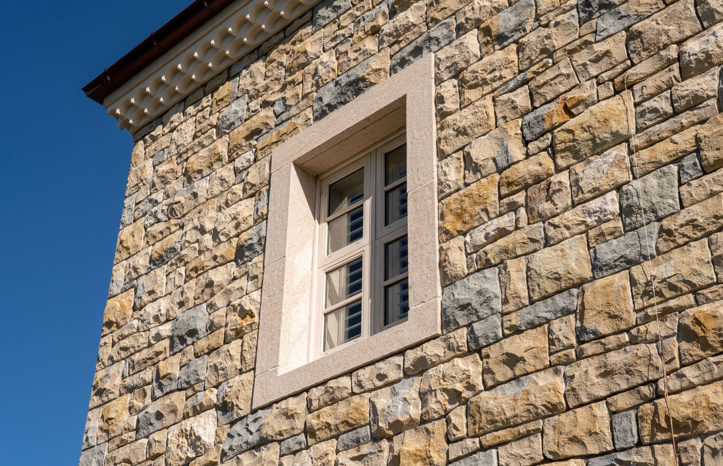 The stonework was purposefully laid to look imperfect and asymmetrical, to better suit the rustic, rural feel.
