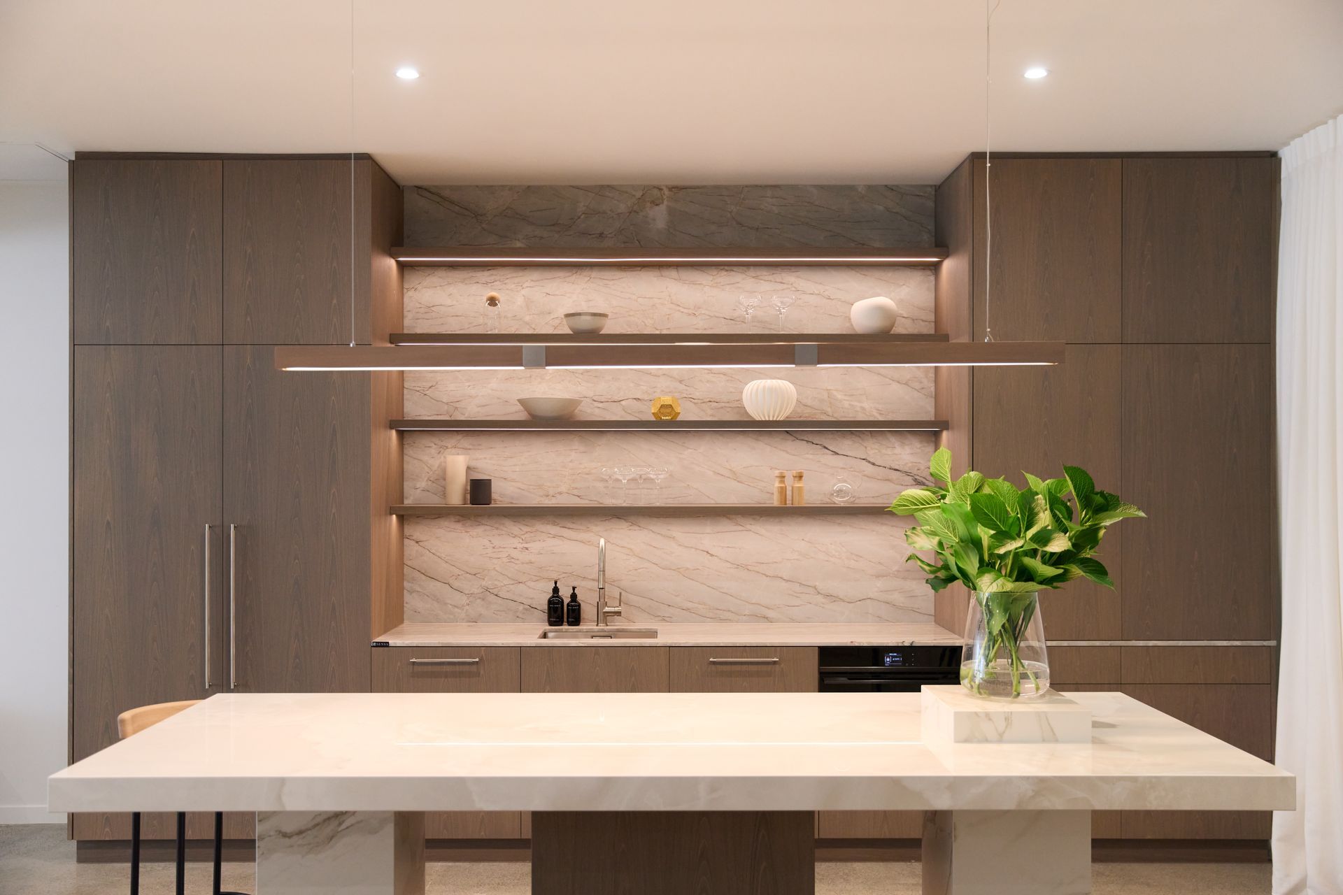 Modi Design selected a soft grey stain to enhance the oak's crown cut structure and grain.