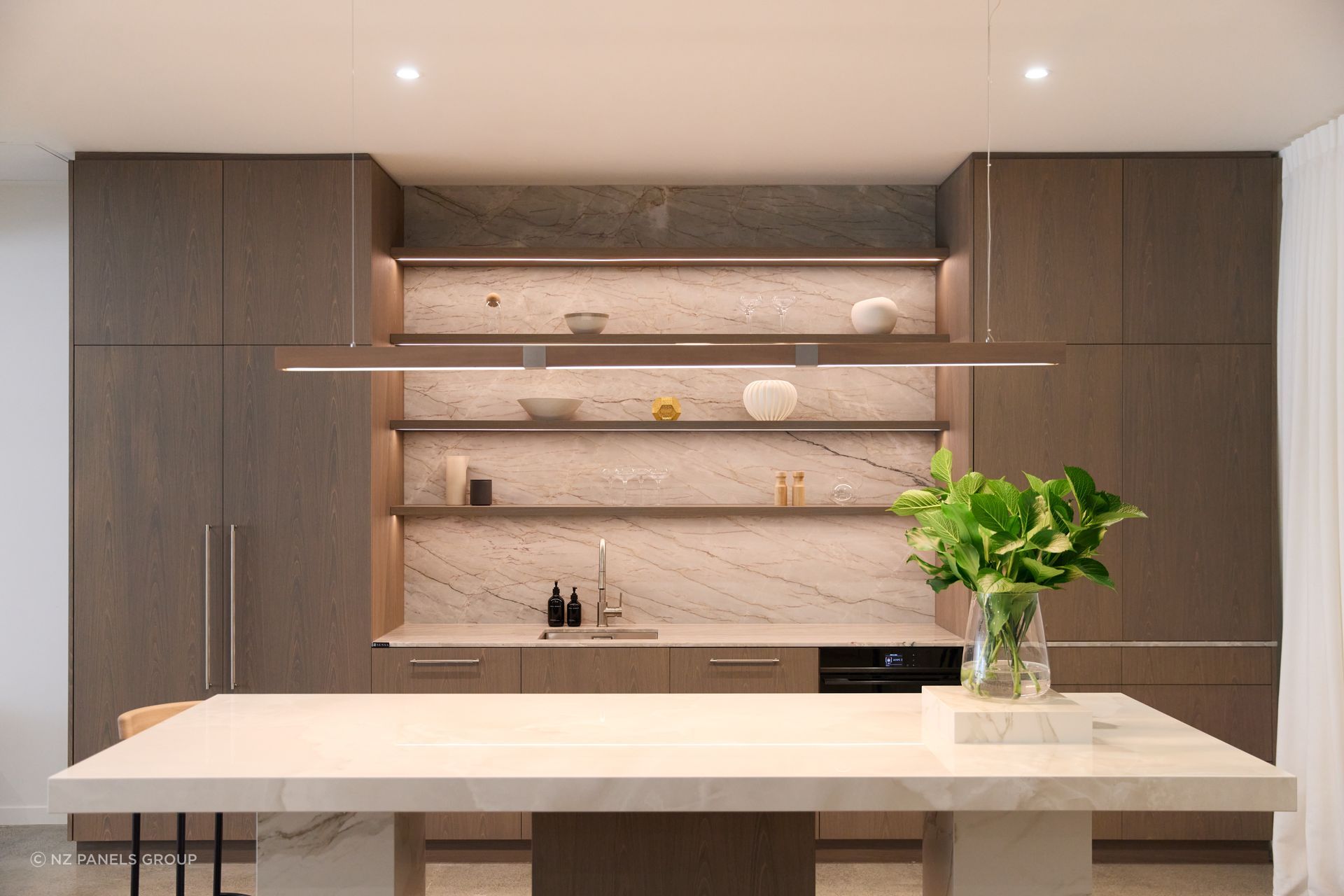 Modi Design selected a soft grey stain to enhance the oak's crown cut structure and grain.