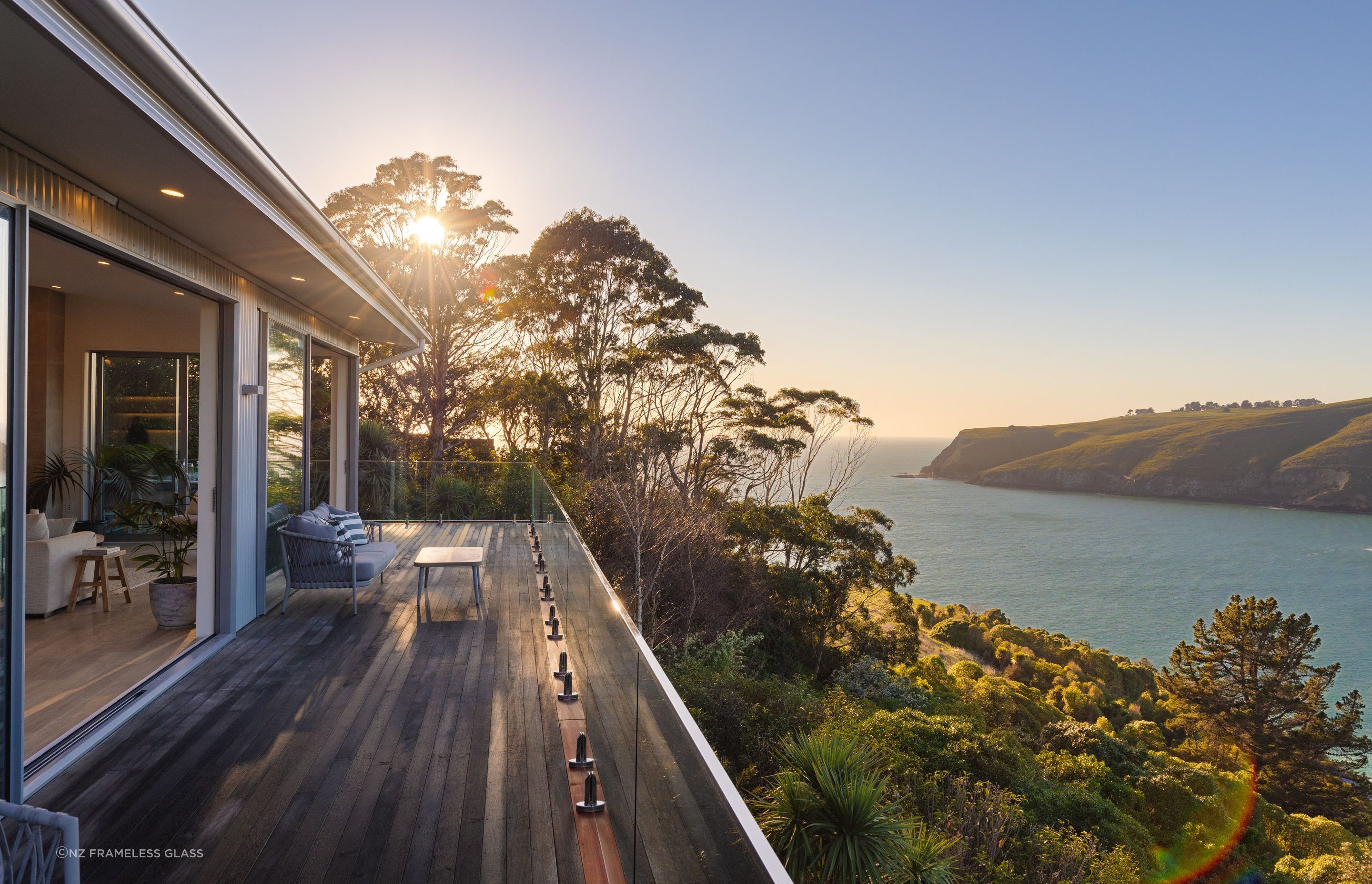 Glass balustrades, like these stylish options by NZ Frameless Glass are an excellent choice for coastal locations.