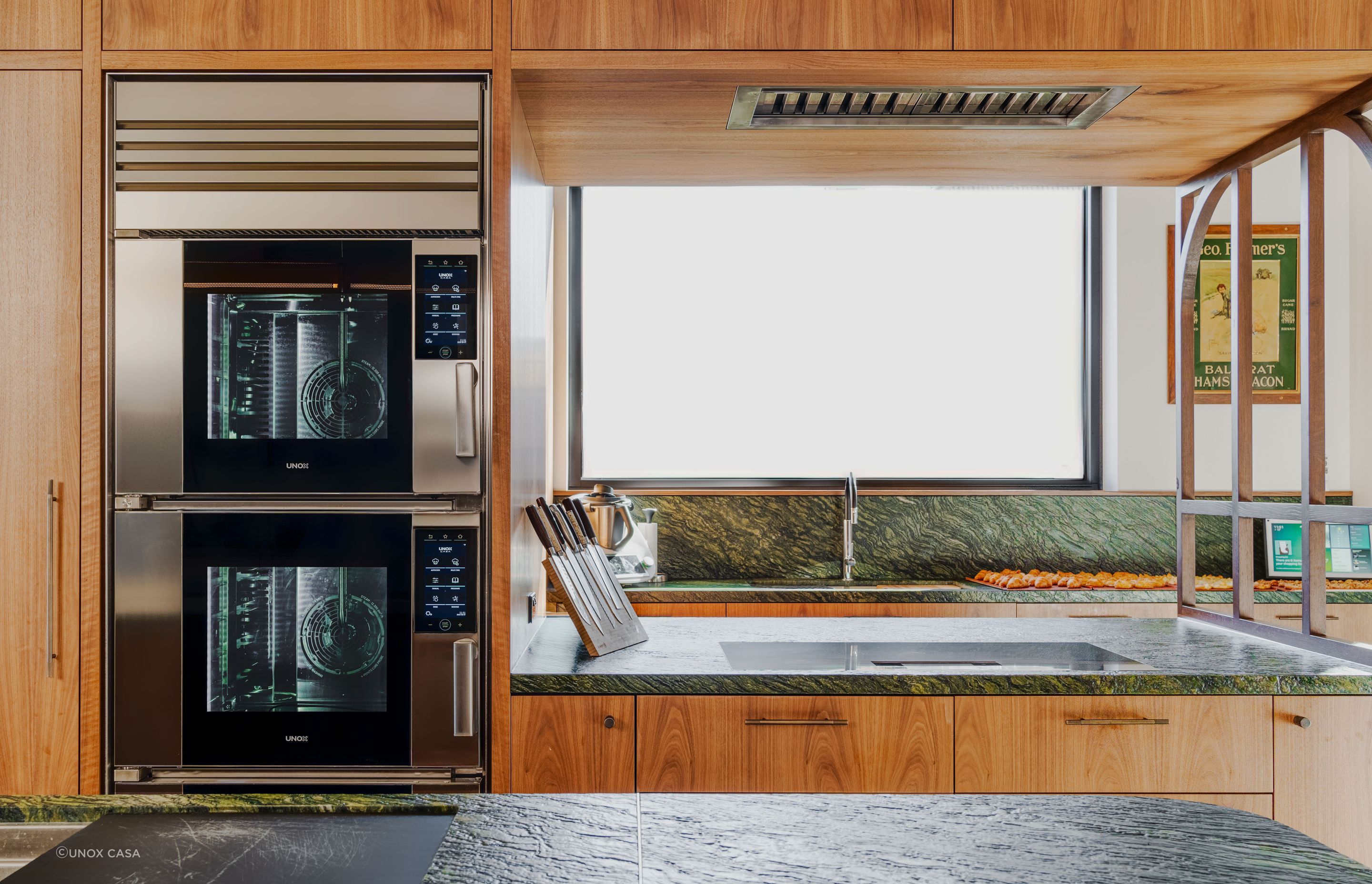 The stainless steel SuperOven is a striking contrast with the surrounding wood.