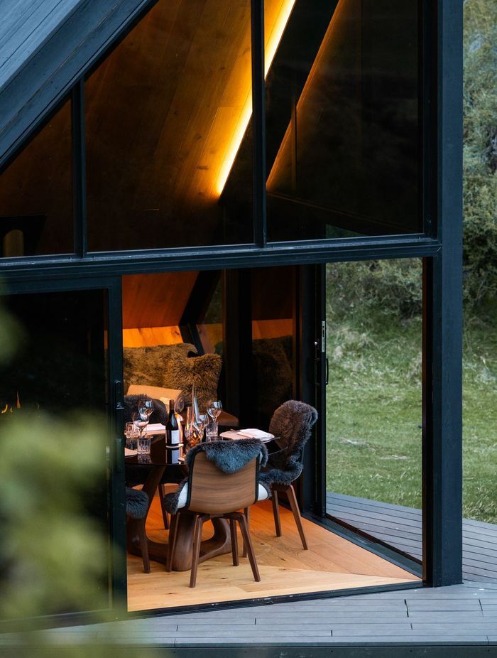 Glass doors slide back to give access to the small, angular deck.