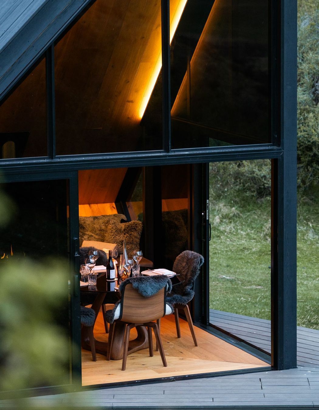 Glass doors slide back to give access to the small, angular deck.