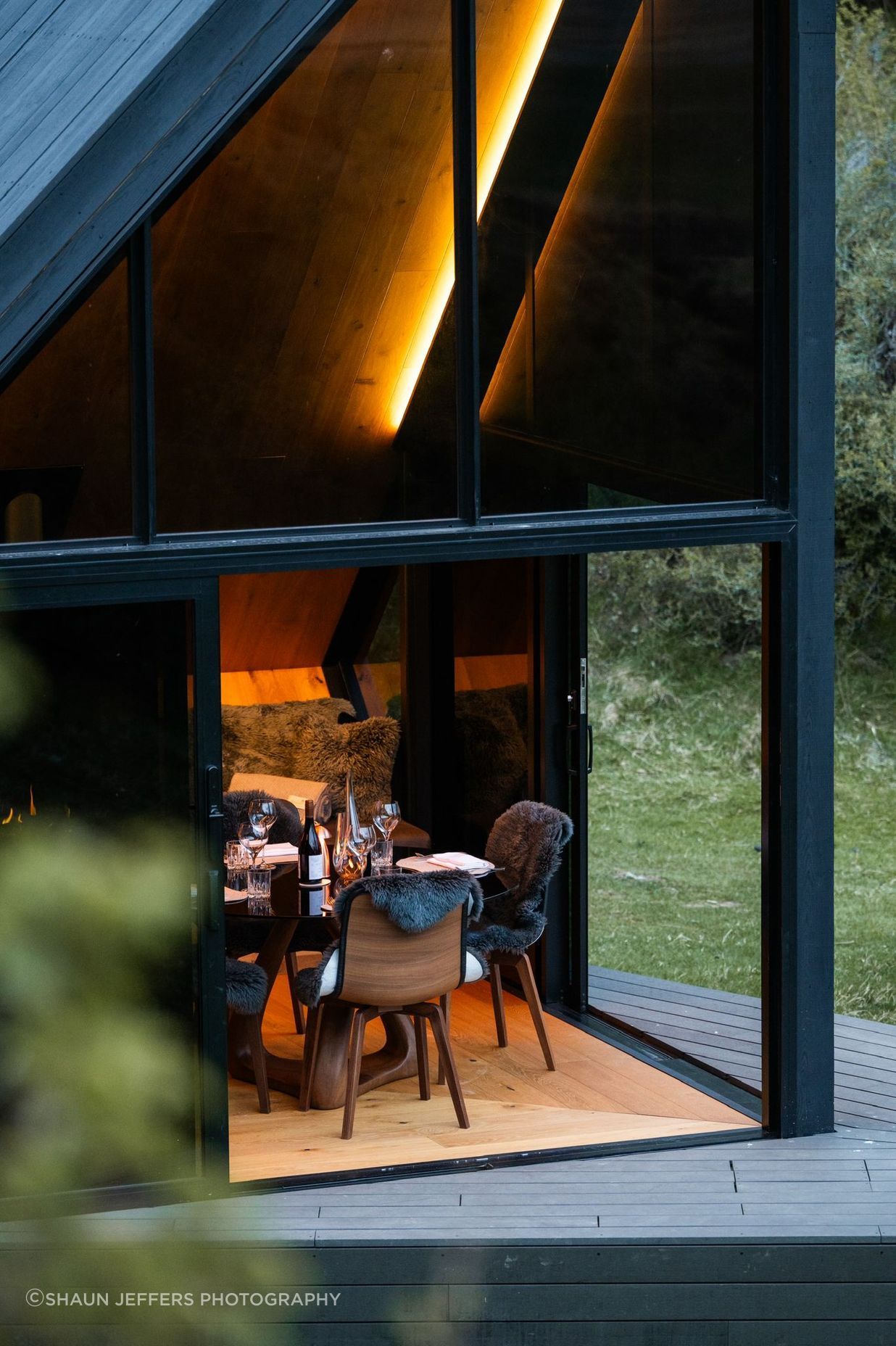 Glass doors slide back to give access to the small, angular deck.