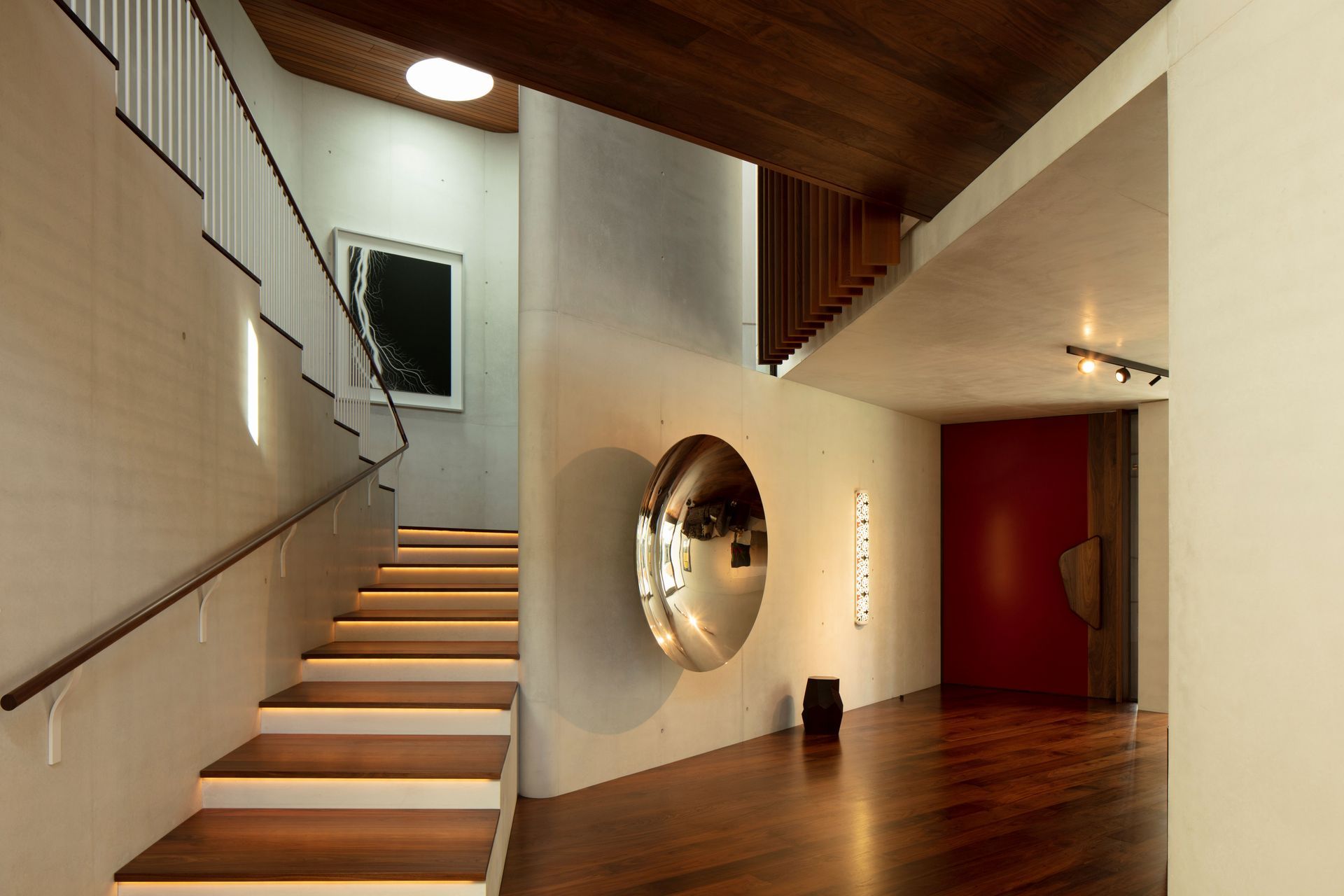 The angles of a 'slow' stair juxtapose beautifully against the curves of the Superwhite internal concrete walls.