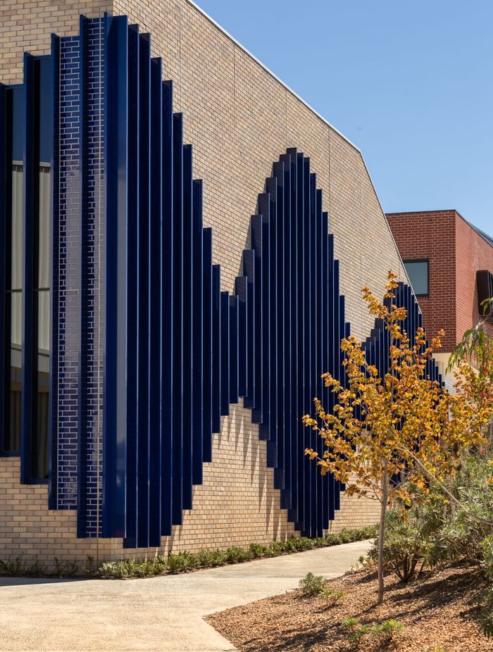 St. Francis Xavier College, featuring Robertson's grey brick and glazed blue tiles.