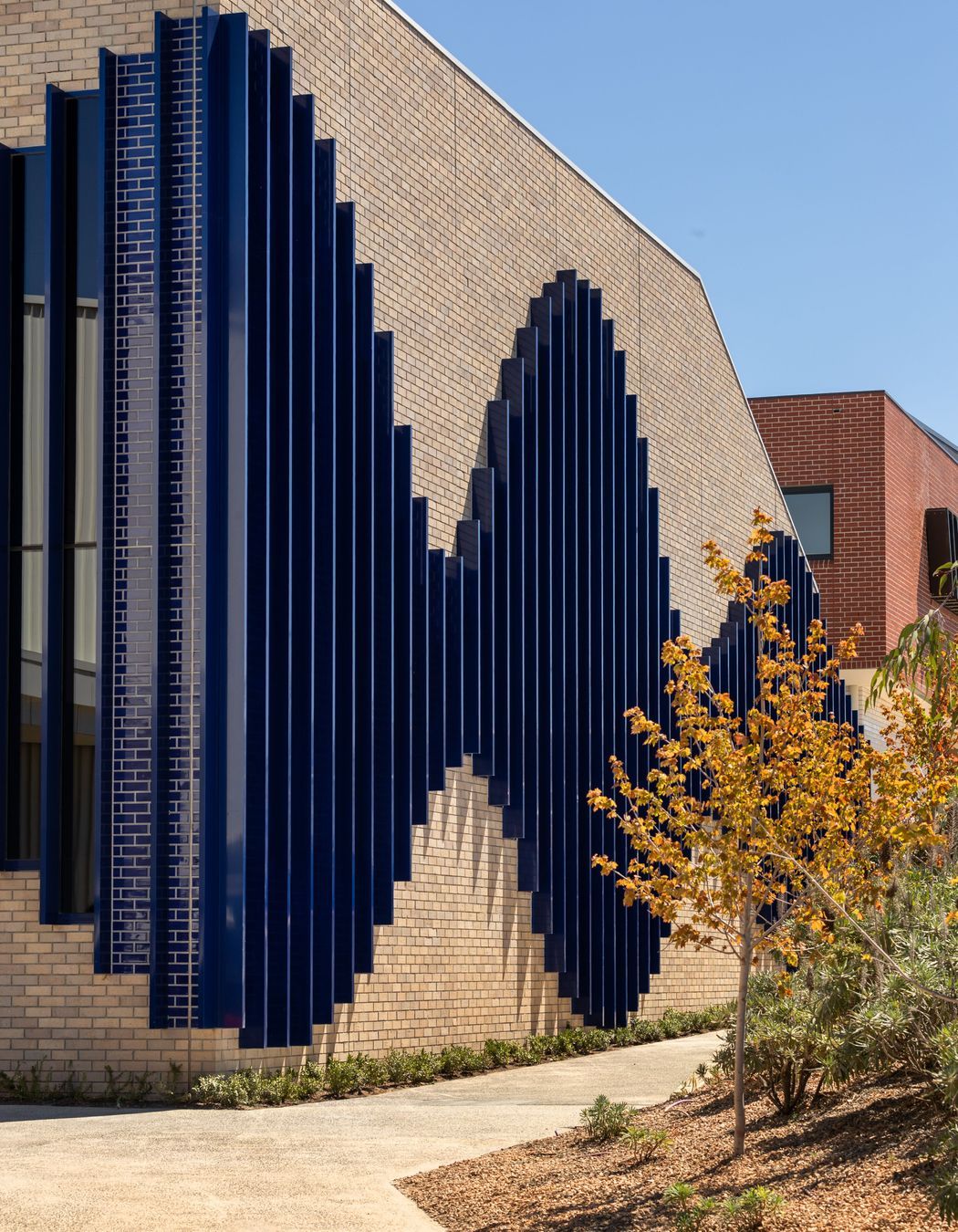St. Francis Xavier College, featuring Robertson's grey brick and glazed blue tiles.