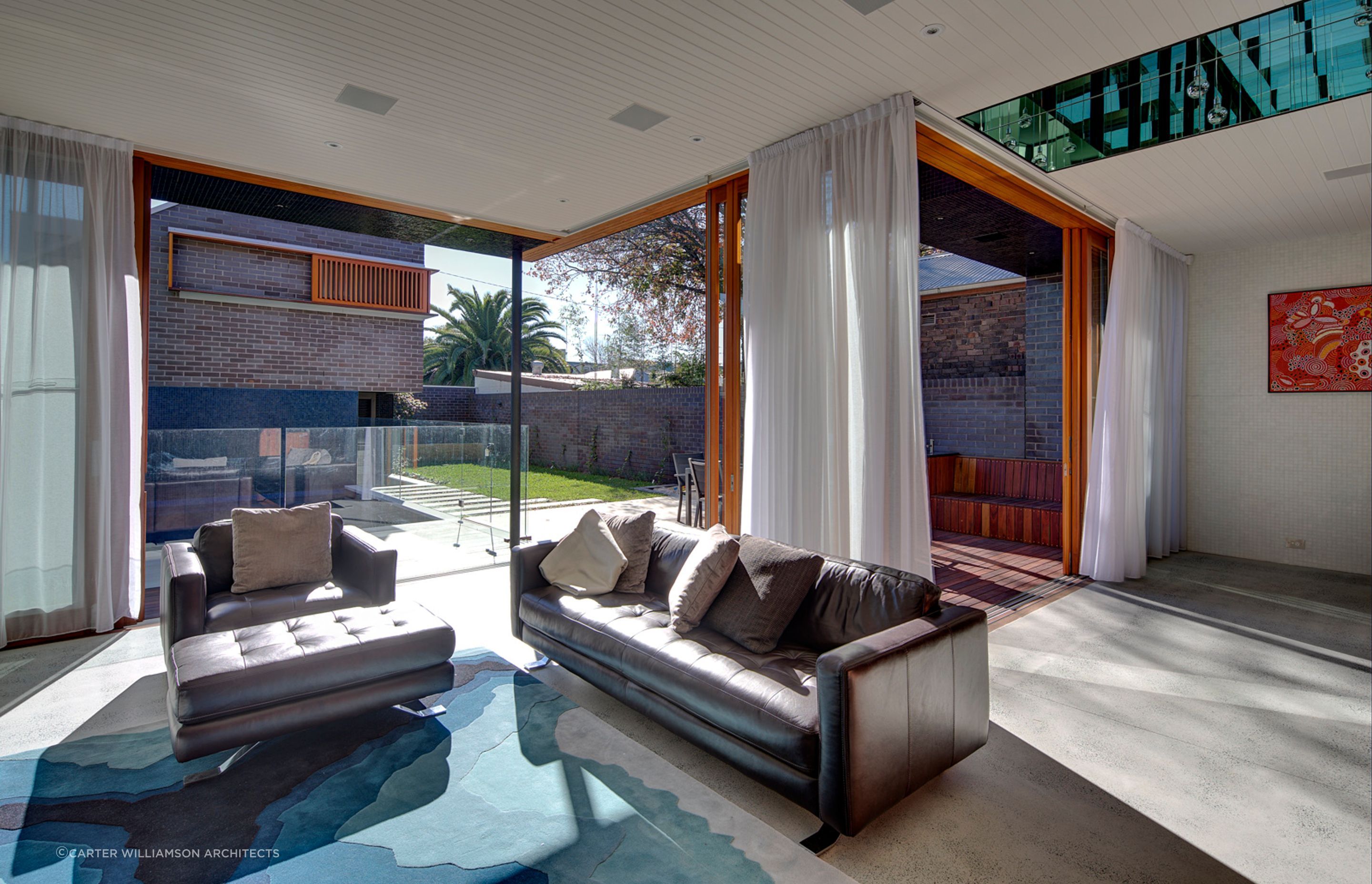 Tasteful furnishings and decor choices make this personal space welcoming for all - Photography: Brett Boardman
