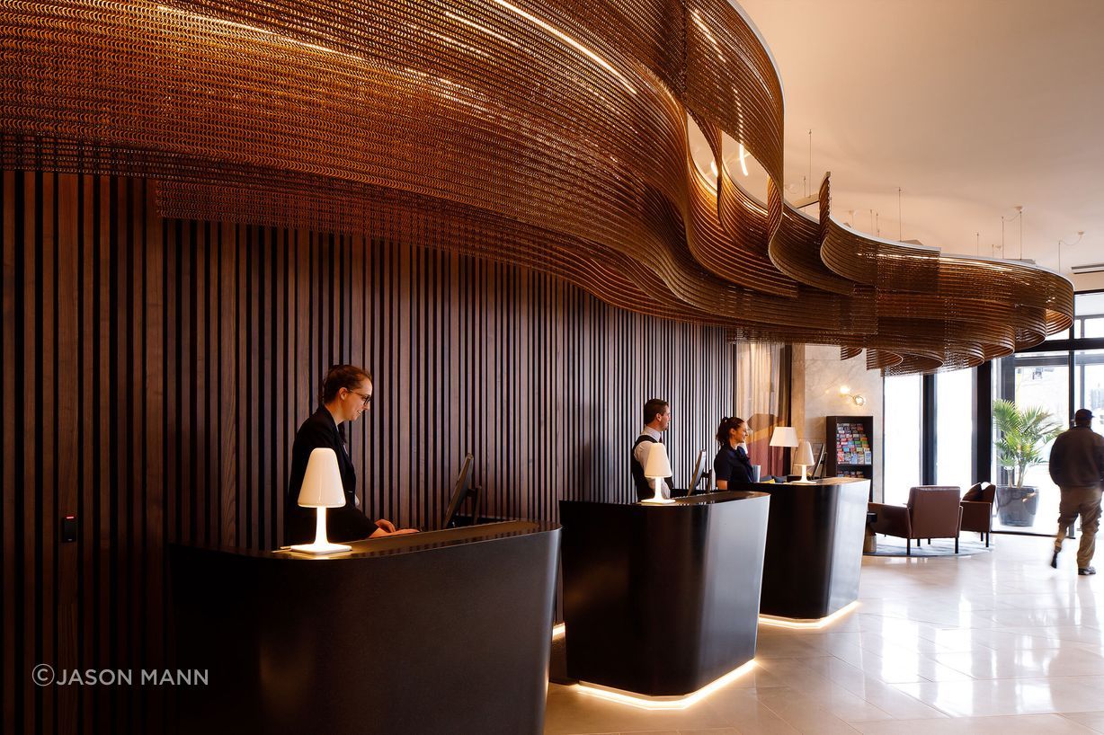 Bronze waves adorn the reception area of Christchurch's Crowne Plaza.