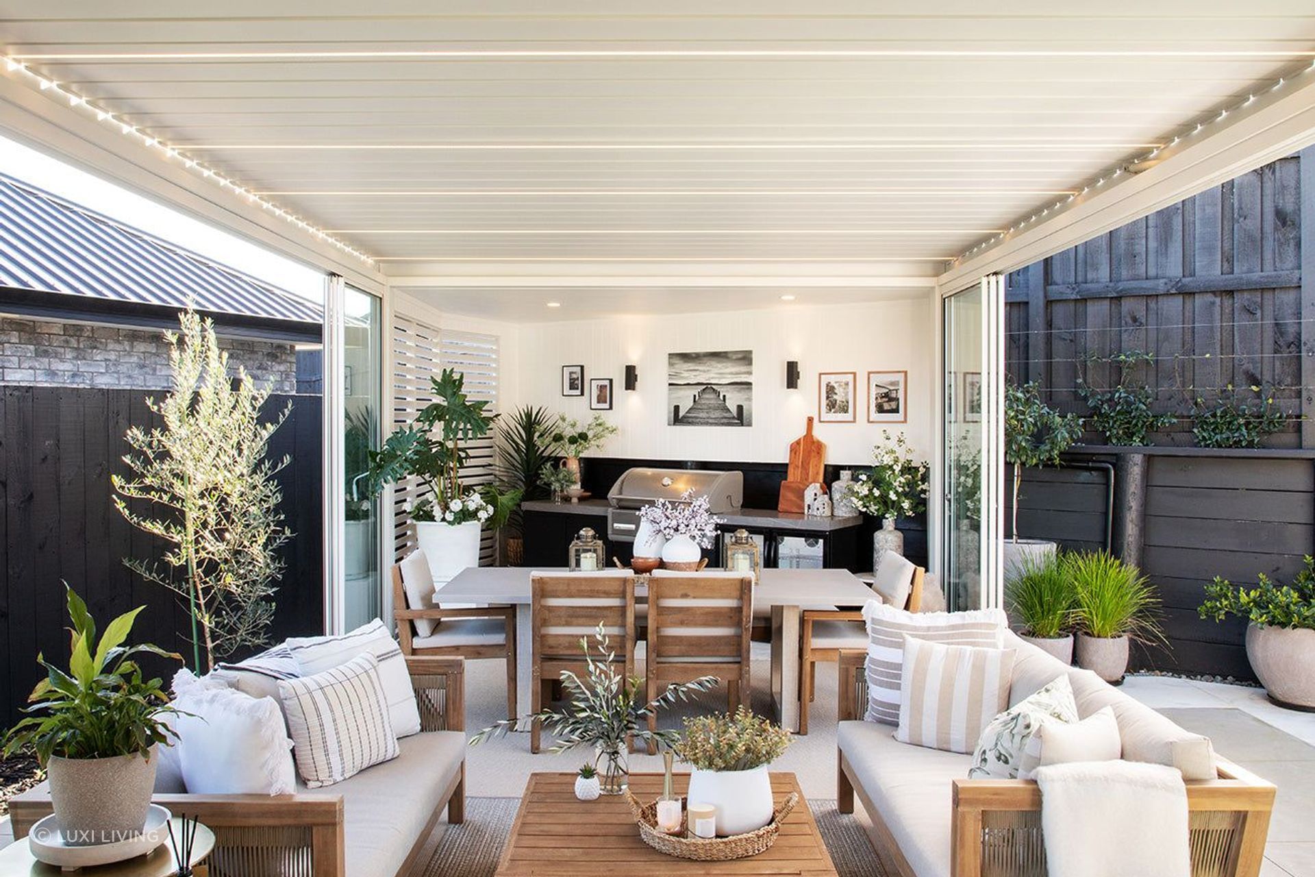 Modern louvred pergola systems can be fitted with a range of accessories like glass doors and lighting.
