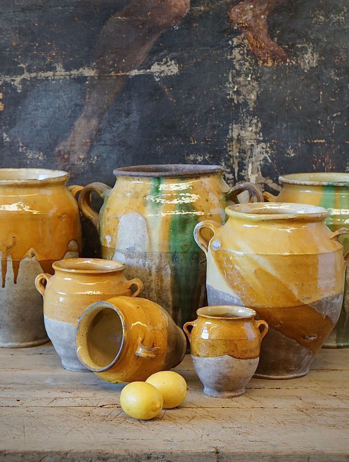 French antique confit pots are a great way of adding texture and a sense of history to an interior.