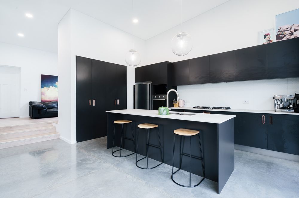 Dark & concrete kitchen by JPC Kitchens