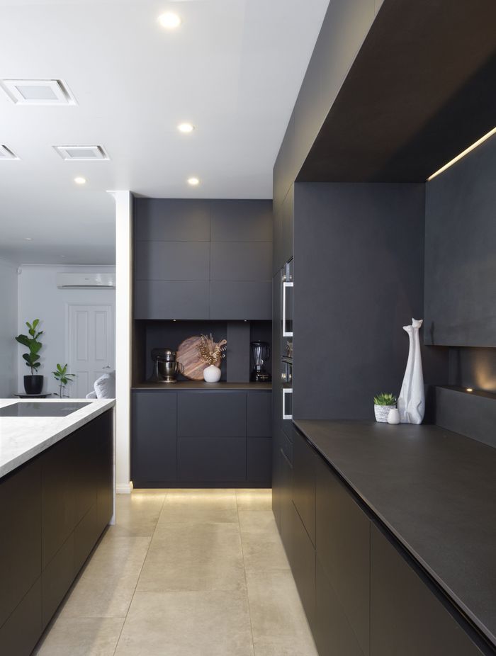 Matte black cabinetry adds a sophisticated feel.