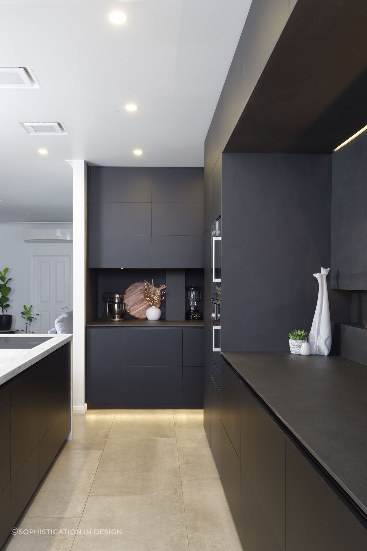 Matte black cabinetry adds a sophisticated feel.