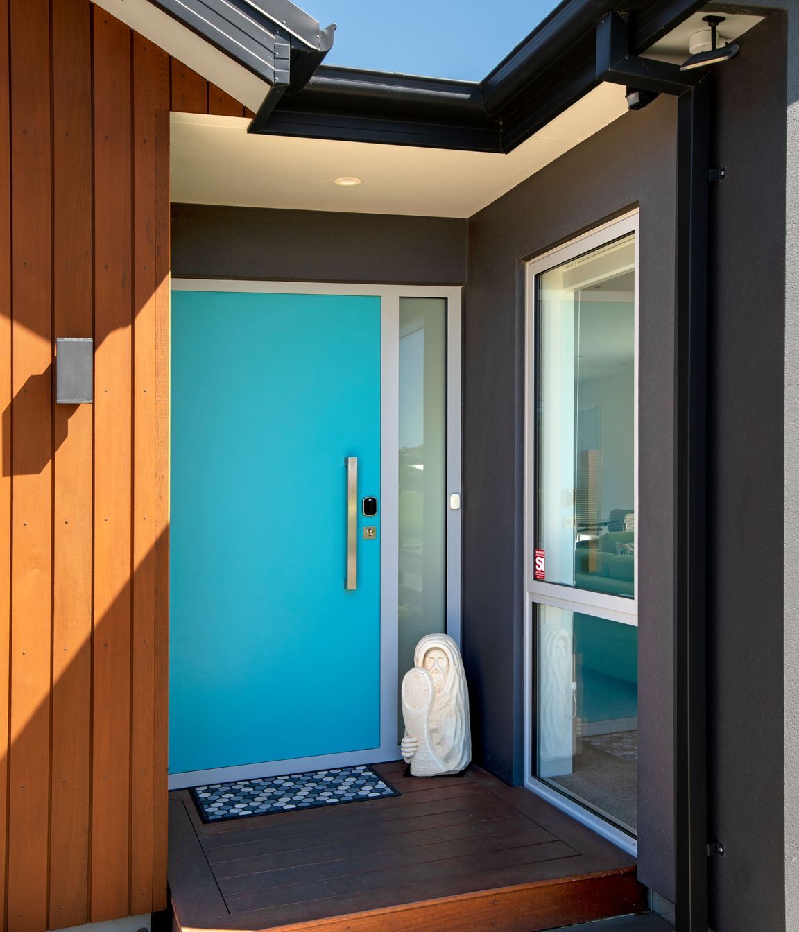 A single panel composite door becomes a feature in bright turquoise blue.
