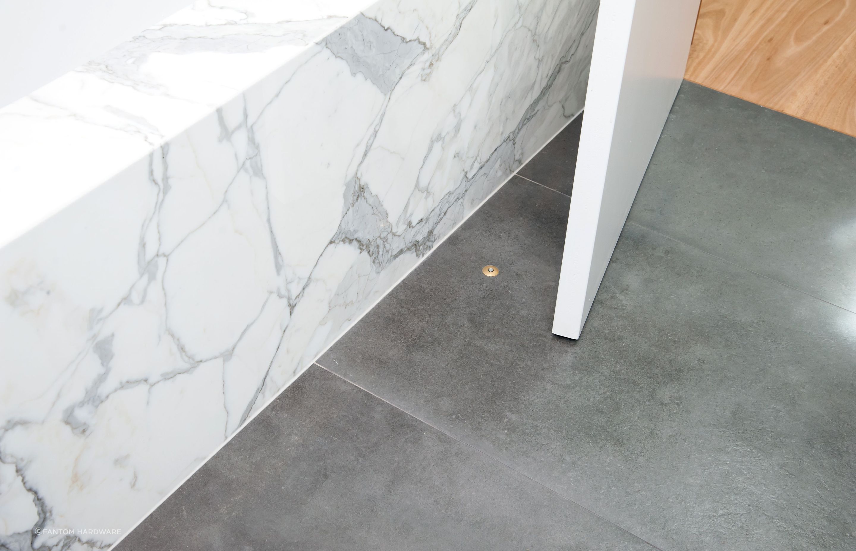 The subtle Fantom Doorstop in brass is a great example of innovations in hardware enabling sleeker, more contemporary design.