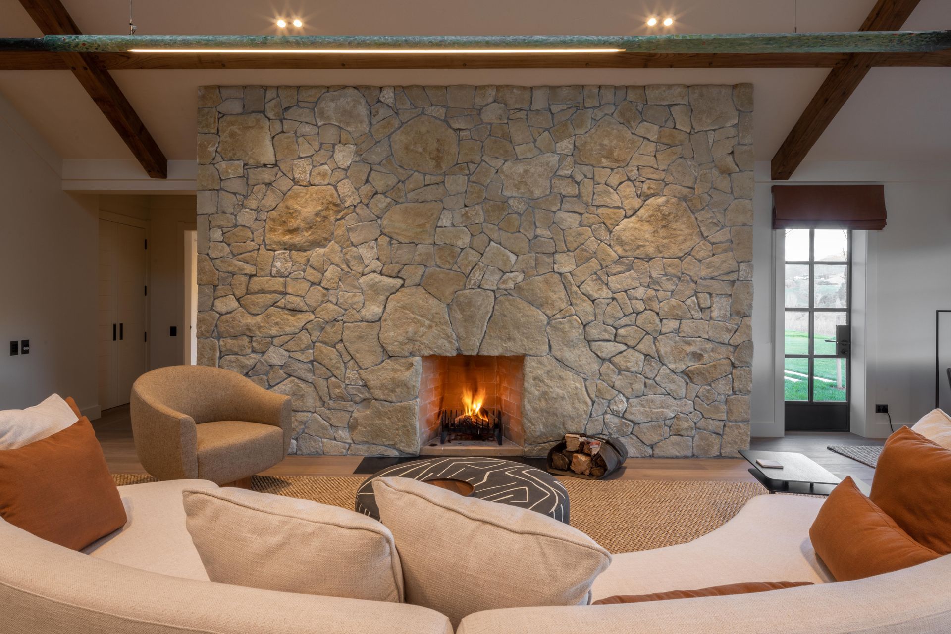 This fireplace installation features bespoke over-sized stones, helping it stand out.