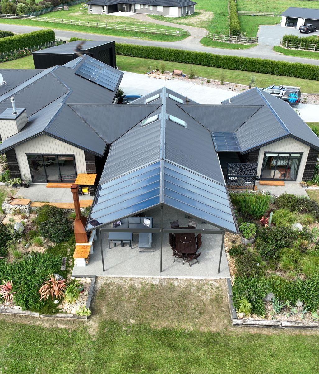 Archgola’s new gable profile creates a seamless transition between roof and canopy for this Ashburton home