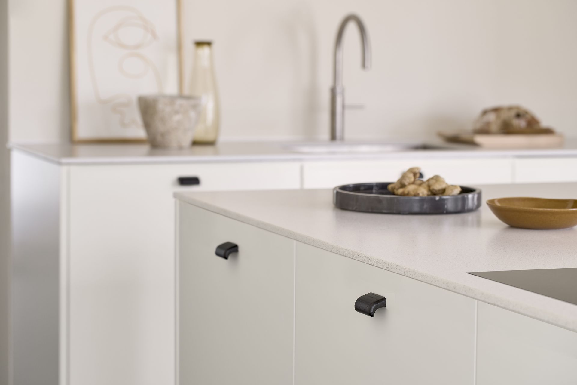 The texture of wood with the contrast of matte black adds intrigue to this modern kitchen.