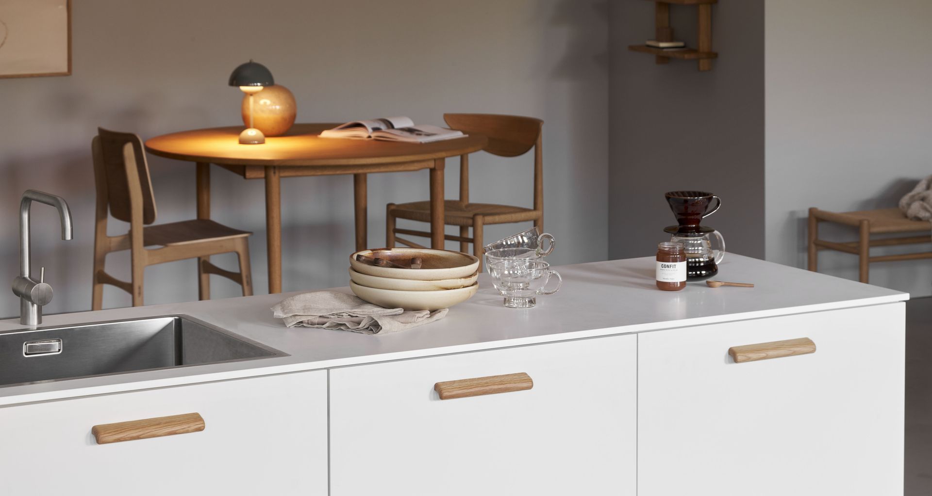 Cabinet hardware should complement the kitchen's overall design and colour.
