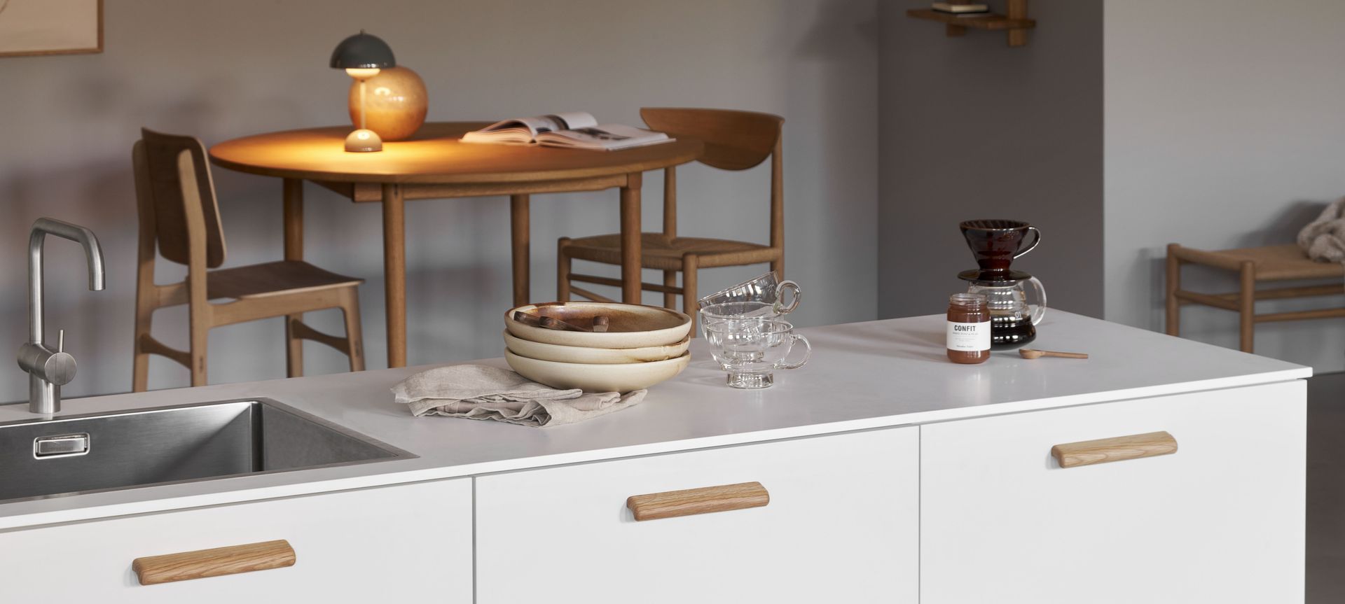 Cabinet hardware should complement the kitchen's overall design and colour.