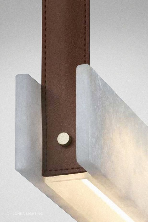 Look for feature lighting with special details such as the affordable Slate linear pendant featuring stone, brass and leather from ilonka lighting.