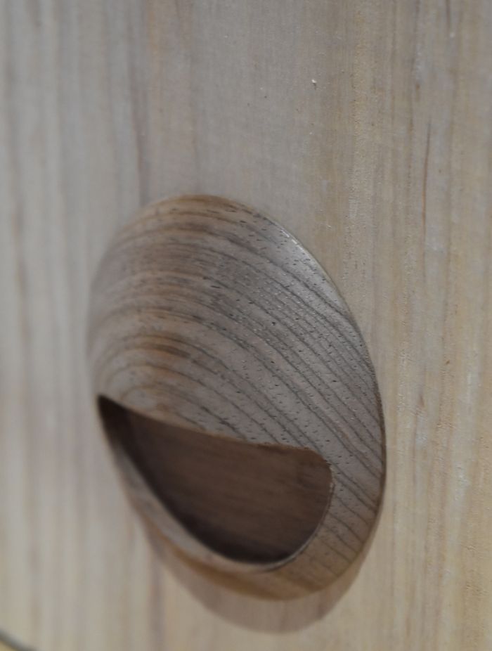 The inset pull are a recessed handle fixed within a mortised cavity that allows fingertips to pull the door outward