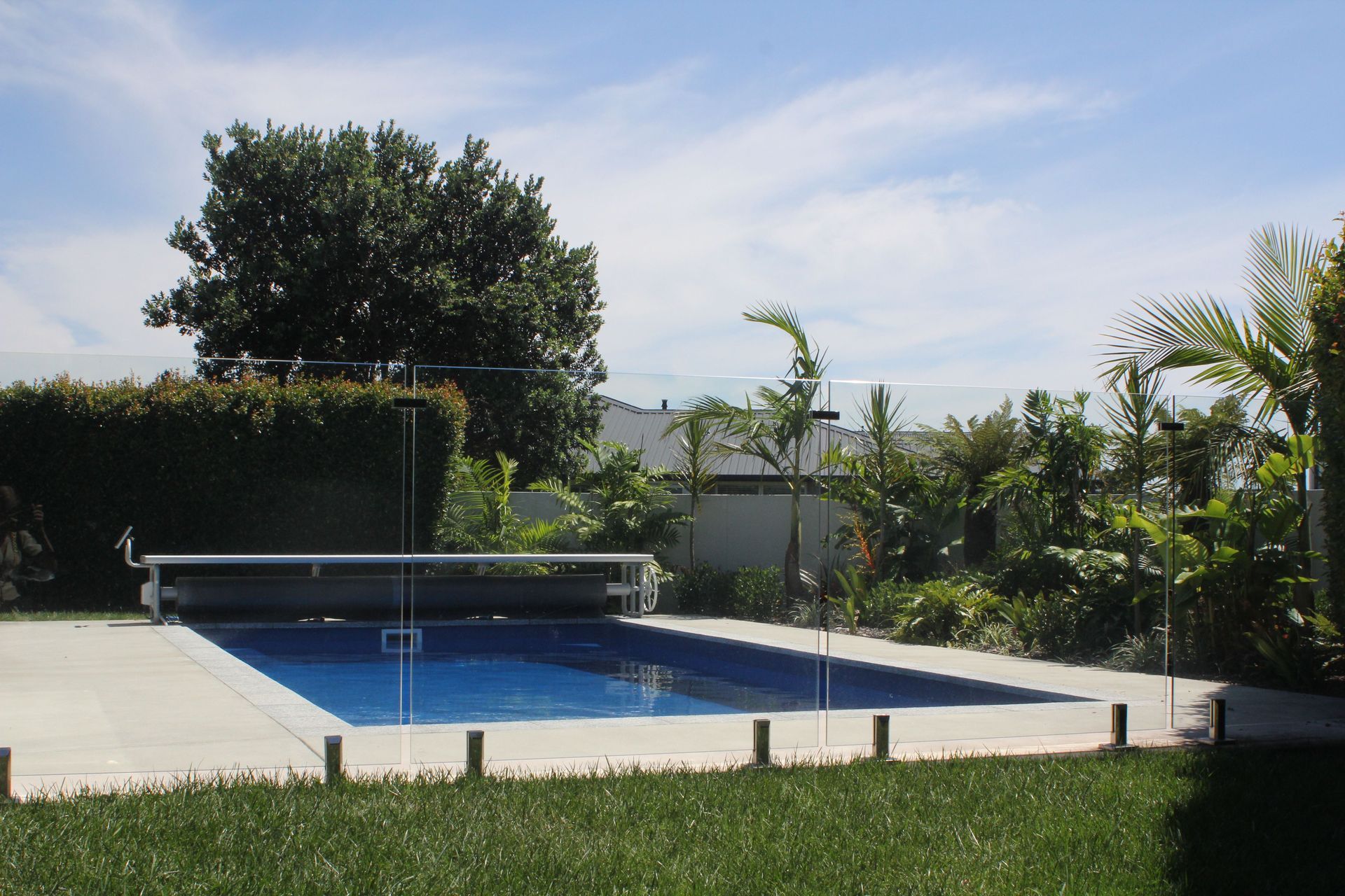 A stunning in-ground pool with retractable cover by Poolpac in Papamoa, Bay of Plenty.