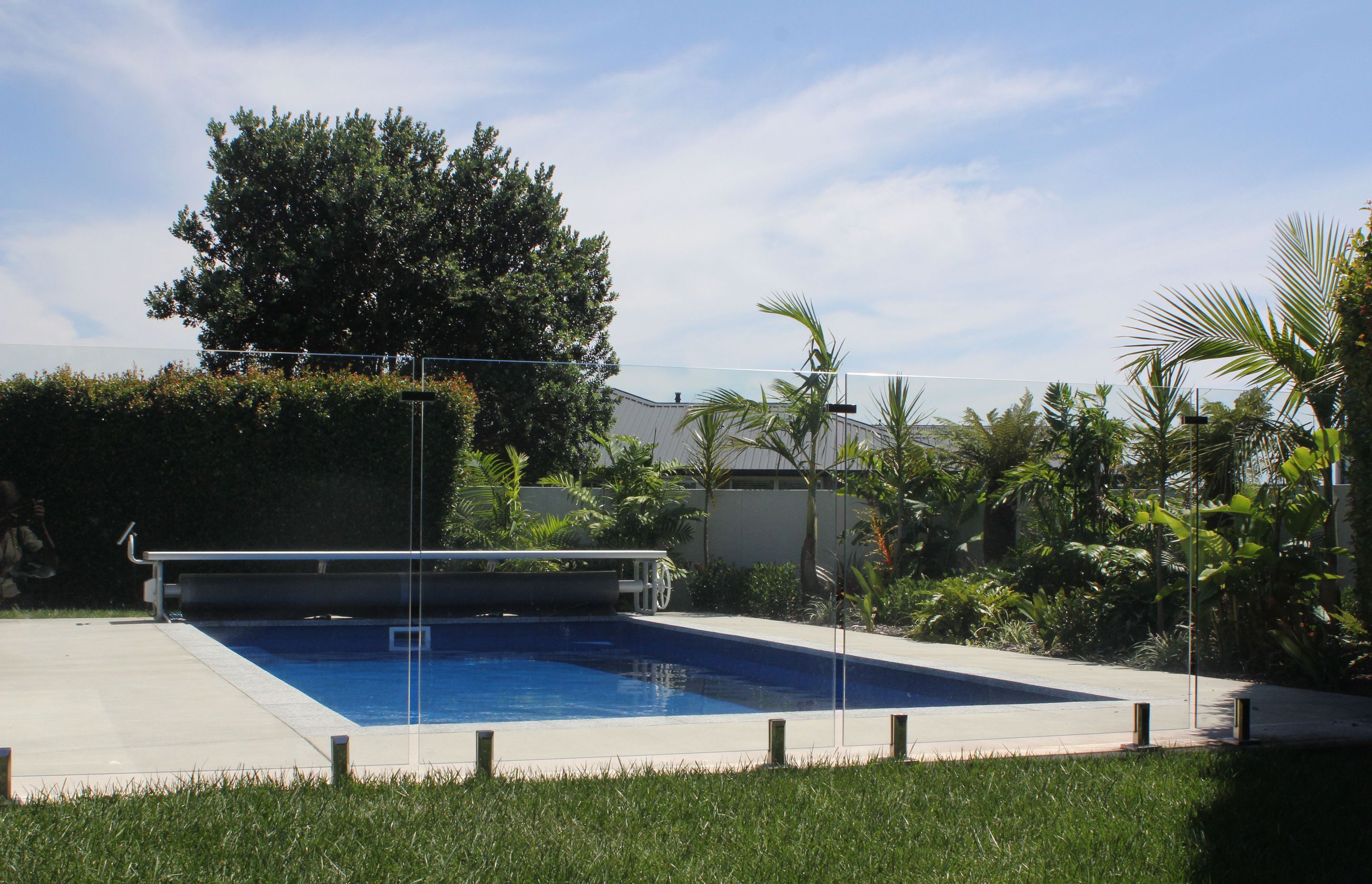 A stunning in-ground pool with retractable cover by Poolpac in Papamoa, Bay of Plenty.