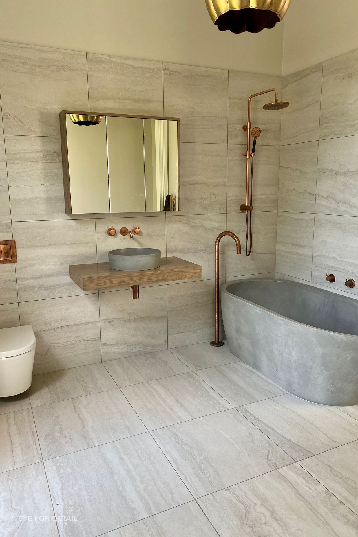 A shower bath combo with style, featuring stunning materials and finishes at this Cheltenham ensuite