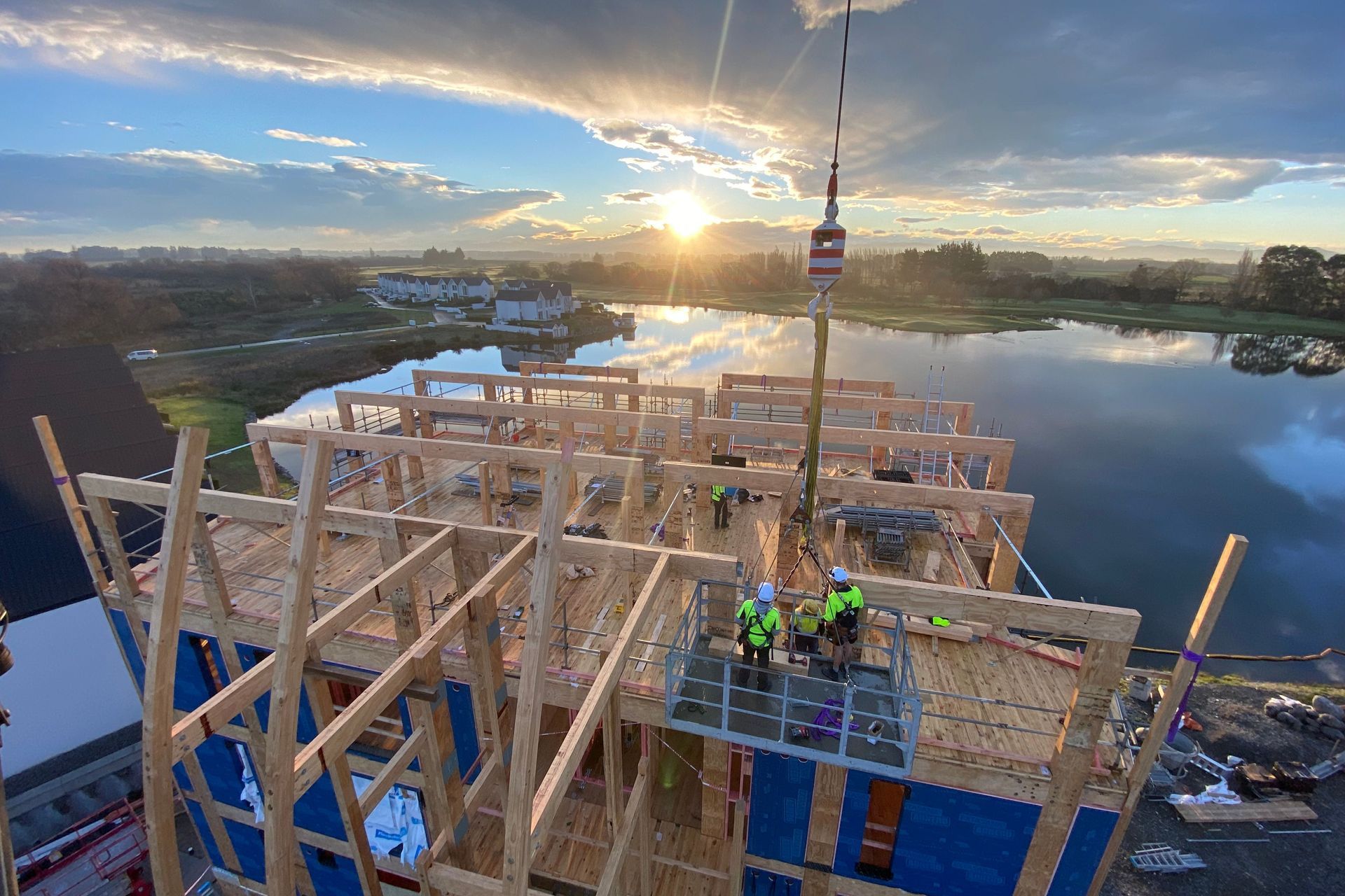 Unlike traditional concrete structures, timber allows for work to continue below erected floors.