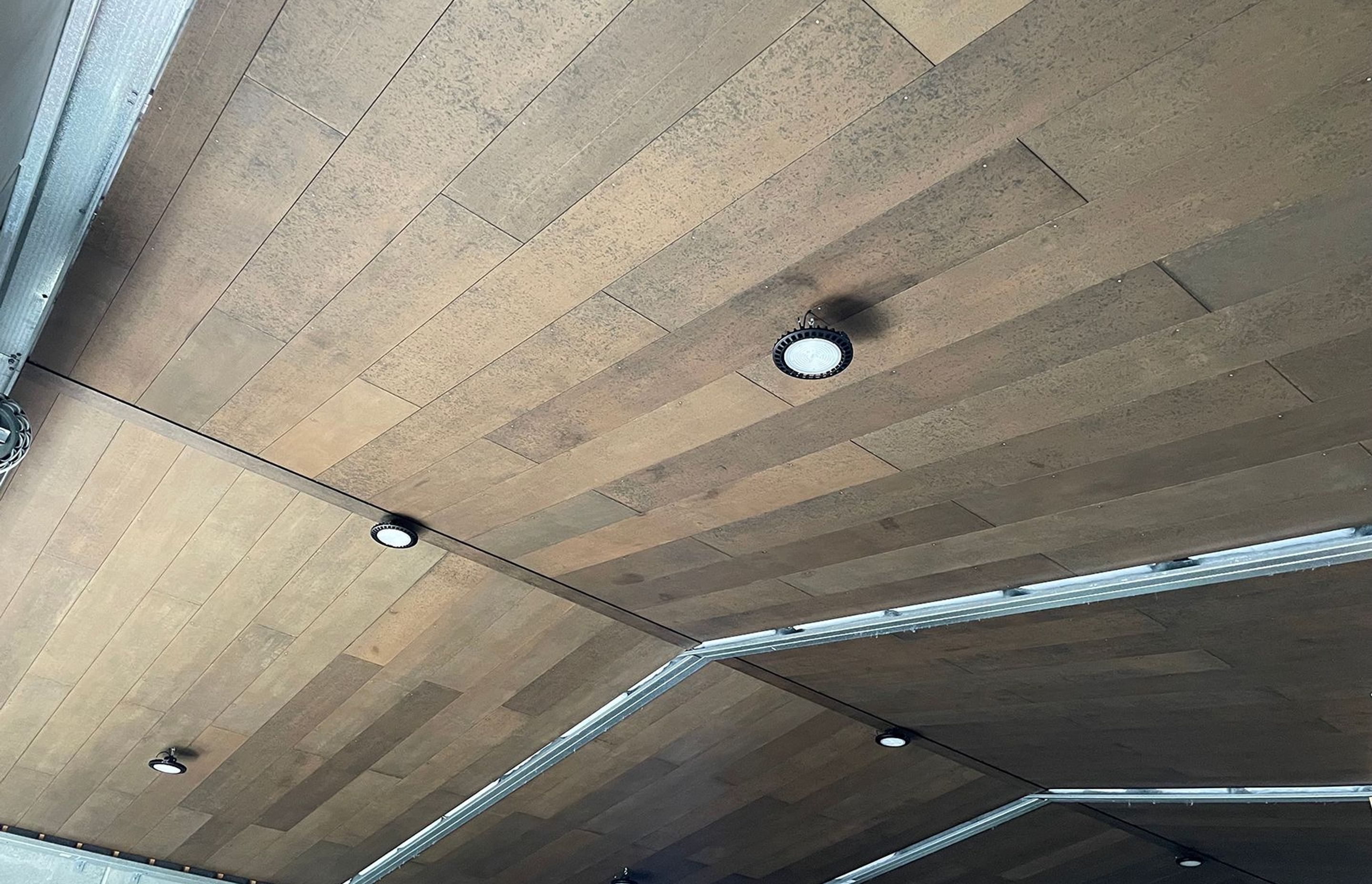 This shed ceiling Triboard TGV lining was stained with WOCA oils, giving it a leather look.