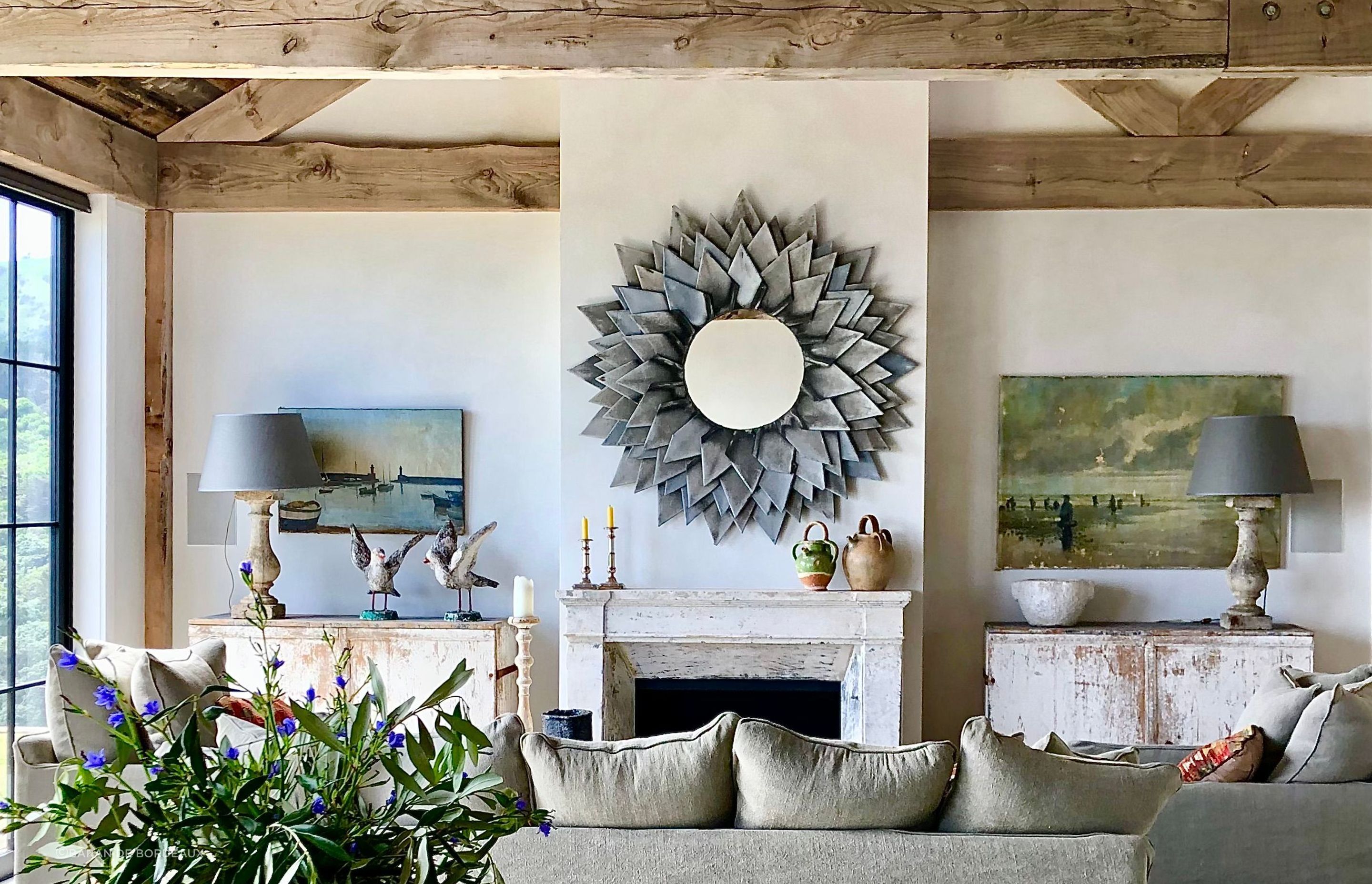 This layered interior makes subtle nods to the seaside through artwork and distressed antique sideboards. All items from Baran de Bordeaux.