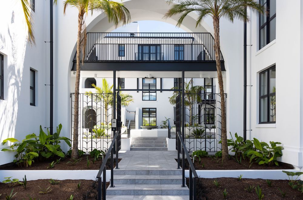 The entranceway of the Arches apartment complex from the street.